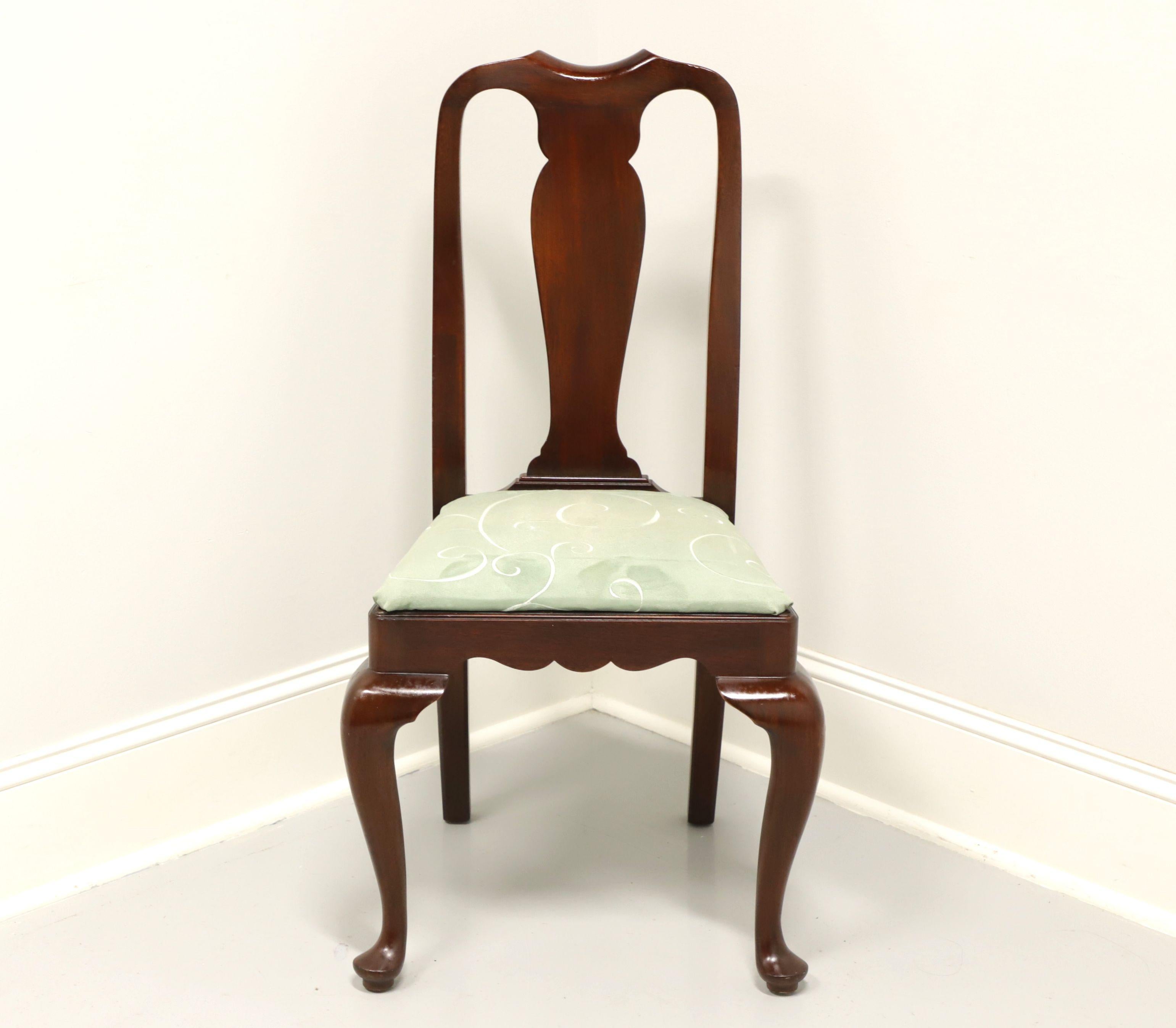 A Queen Anne style dining side chair by Henkel Harris, of Winchester, Virginia, USA. Solid mahogany, carved center backrest, upholstered seat in a mint green swirl fabric, cabriole legs and pad feet. Made circa 1976. 

Style #: 109S, Finish:
