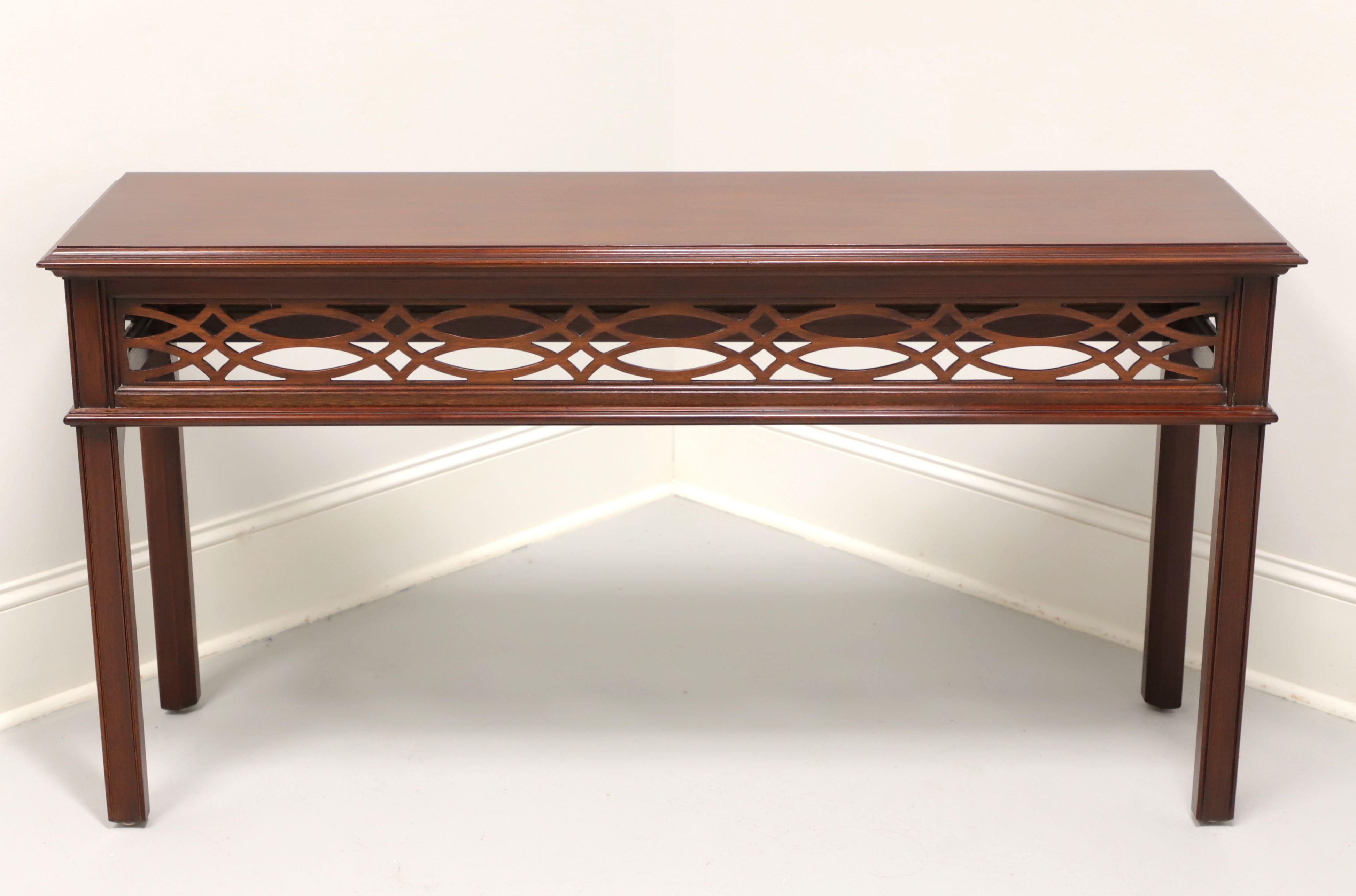 A Chinese Chippendale style sofa table by Henkel Harris. Solid mahogany with bevel edge top, open decorative fretwork to apron, and carved straight legs. Made in Winchester, Virginia, USA, circa 1988.

Style #: 5710, Finish #: 29

Measures: