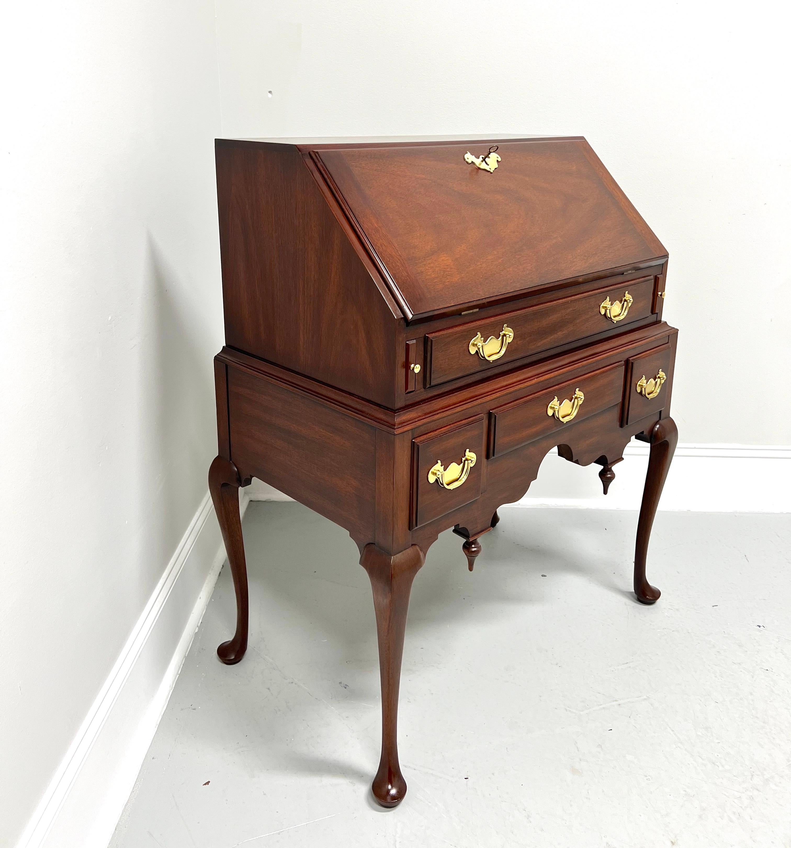 A Queen Anne style drop front secretary desk by Henkel Harris, an SPNEA (Society for the Preservation of New England Antiquities) approved 18th Century reproduction, their Lady Astor. Solid mahogany with brass hardware, slant drop front desk top,