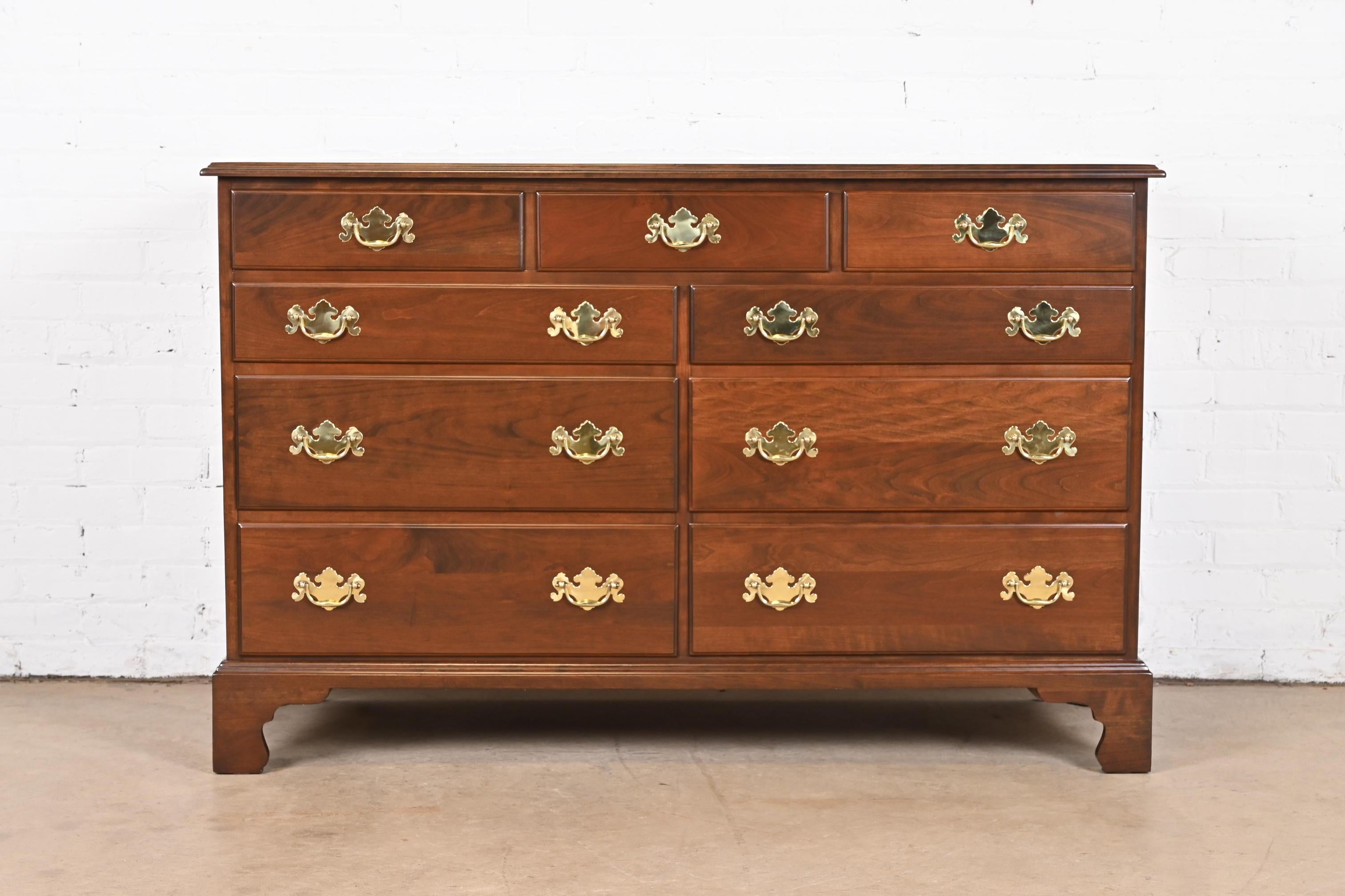 An exceptional American Chippendale or Georgian style nine-drawer dresser or credenza

By Henkel Harris

USA, Circa 1970s

Carved solid cherry wood, with original brass hardware.

Measures: 54.25
