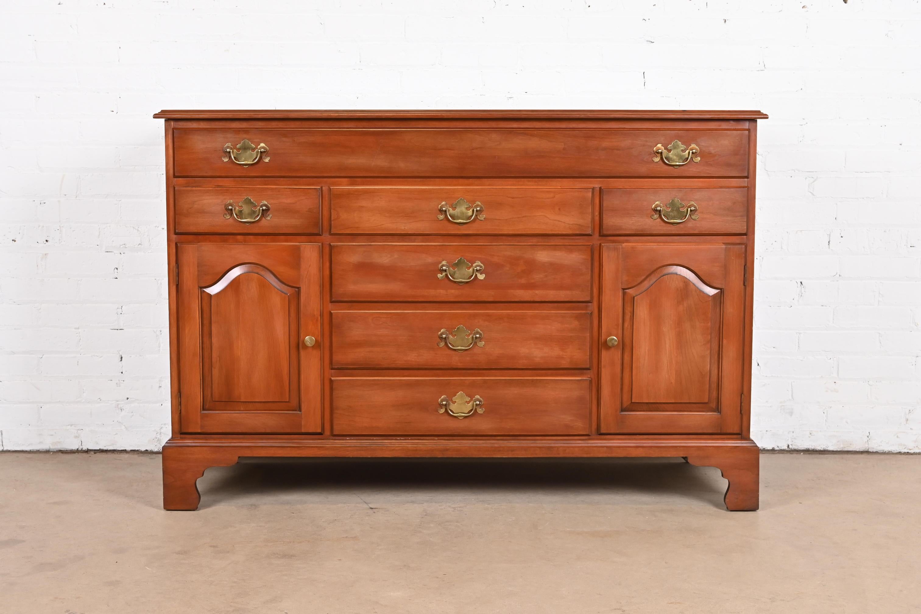 A gorgeous American Colonial or Chippendale style sideboard, buffet server, or bar cabinet

By Henkel Harris

USA, Circa 1970s

Solid wild black cherry wood, with original brass hardware.

Measures: 54