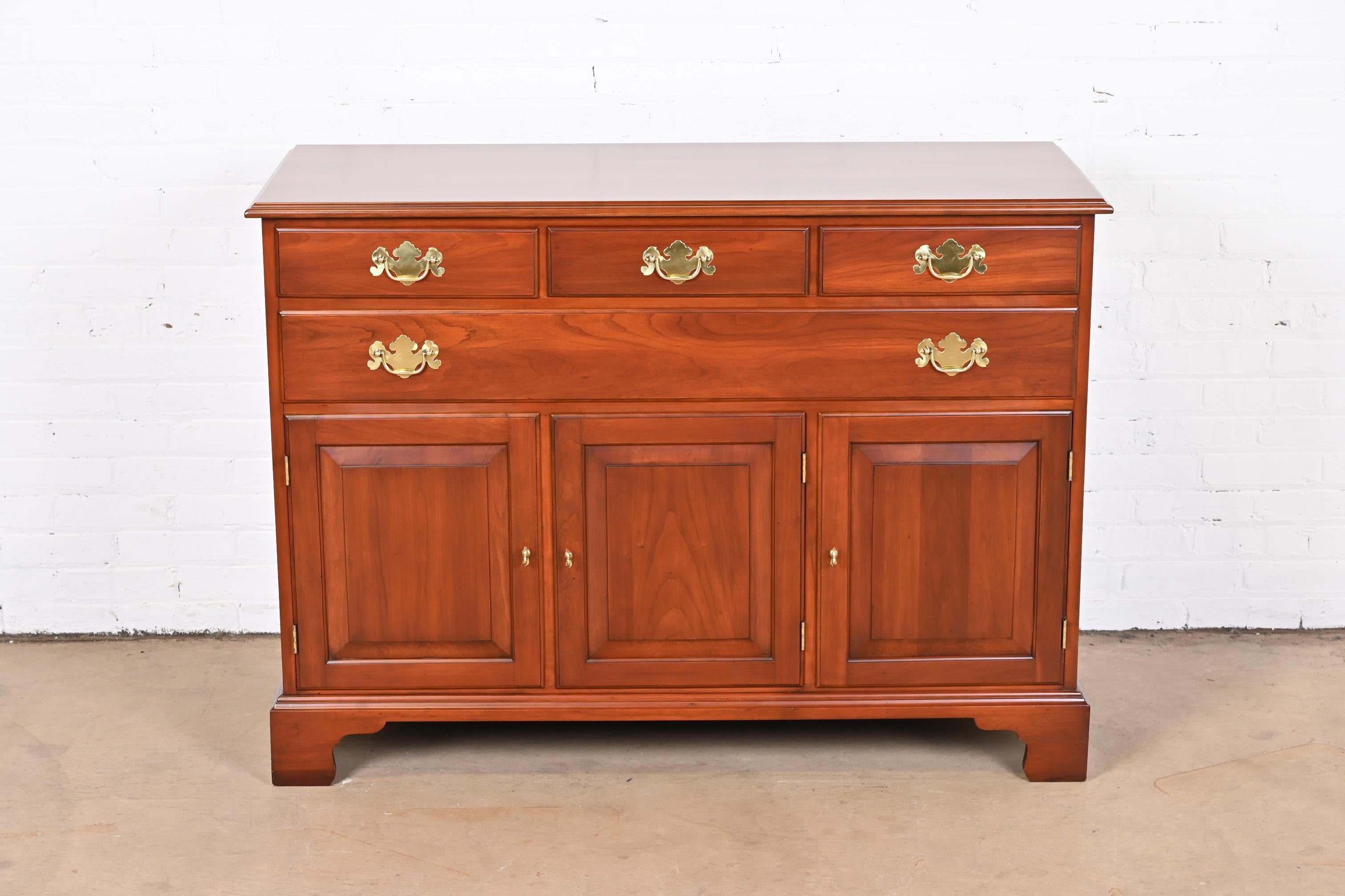 A gorgeous American Colonial or Chippendale style sideboard, buffet server, or bar cabinet

By Henkel Harris

USA, 1970

Solid wild black cherry wood, with original brass hardware.

Measures: 50