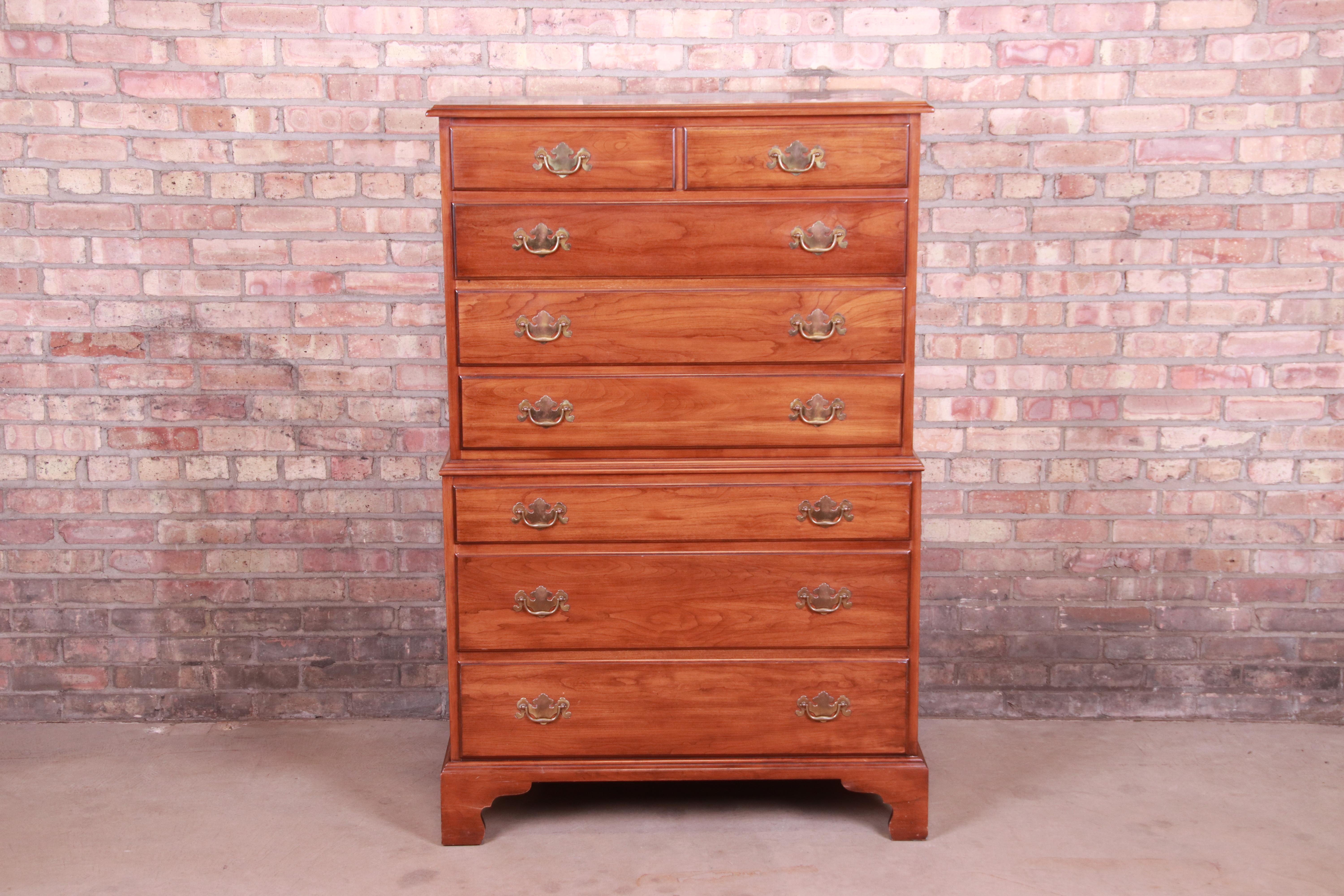 A gorgeous American Colonial or Chippendale style eight-drawer highboy chest of drawers

By Henkel Harris

USA, late 20th century

Solid wild black cherry wood, with original brass hardware.

Measures: 36.25
