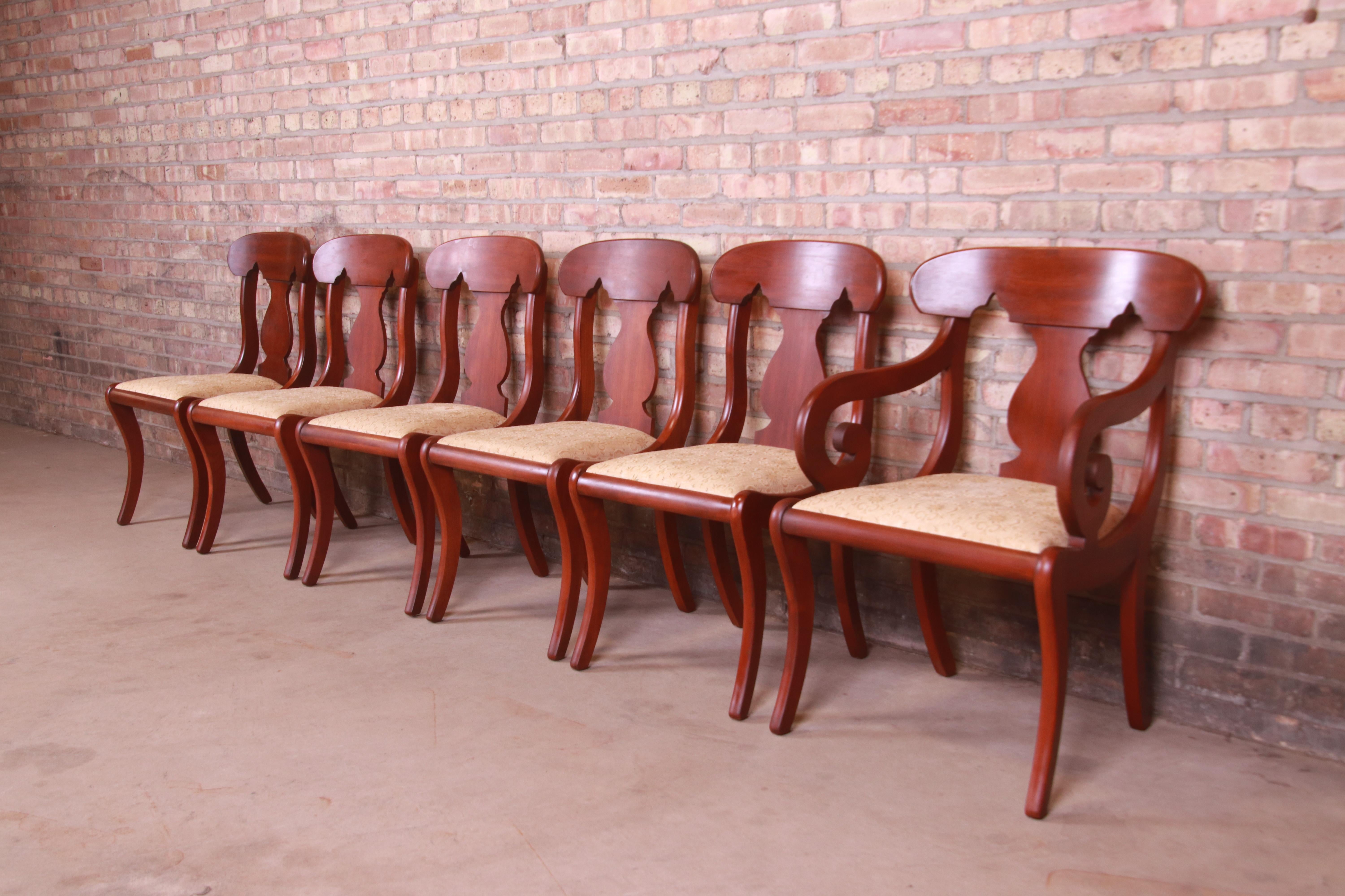 A gorgeous set of six American Colonial style fiddle back dining chairs

By Henkel Harris

USA, Circa 1968

Solid cherry wood frames, with upholstered seats.

Measures:
Side chairs - 18.25