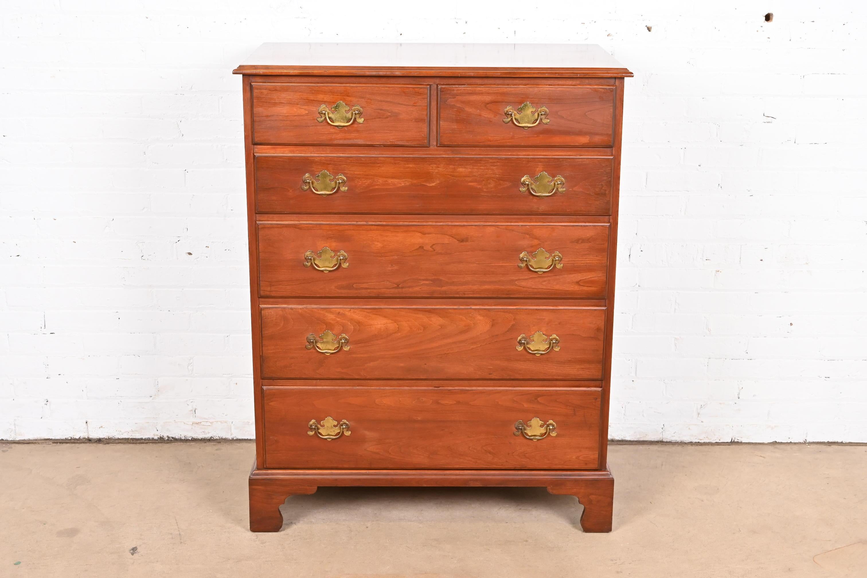 A gorgeous American Colonial or Chippendale style six-drawer highboy dresser or chest of drawers

By Henkel Harris

USA, Circa 1970s

Solid wild black cherry wood, with original brass hardware.

Measures: 36
