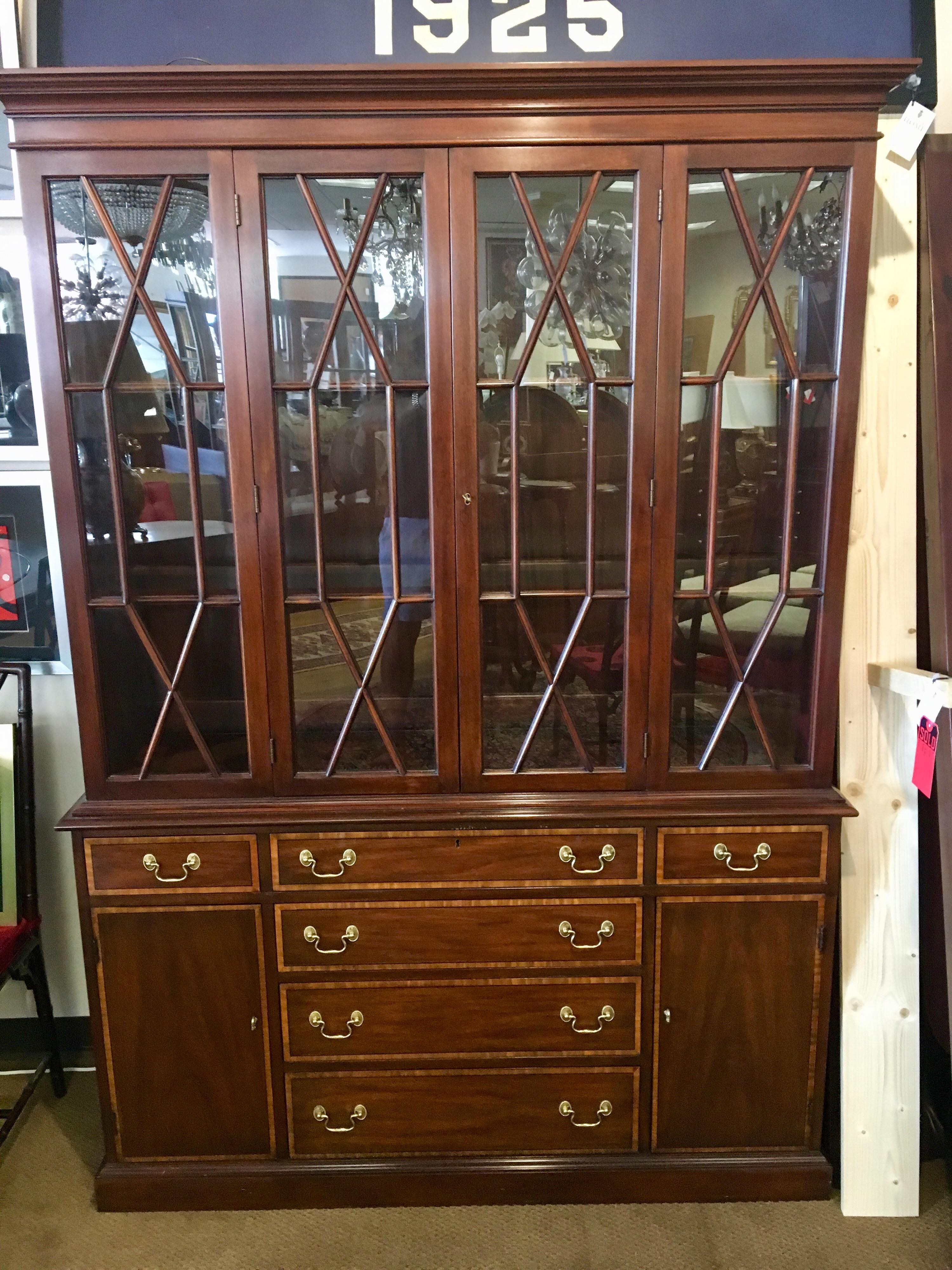 Elegant Henkel Harris mahogany breakfront featuring top and bottom. Why not own the best.