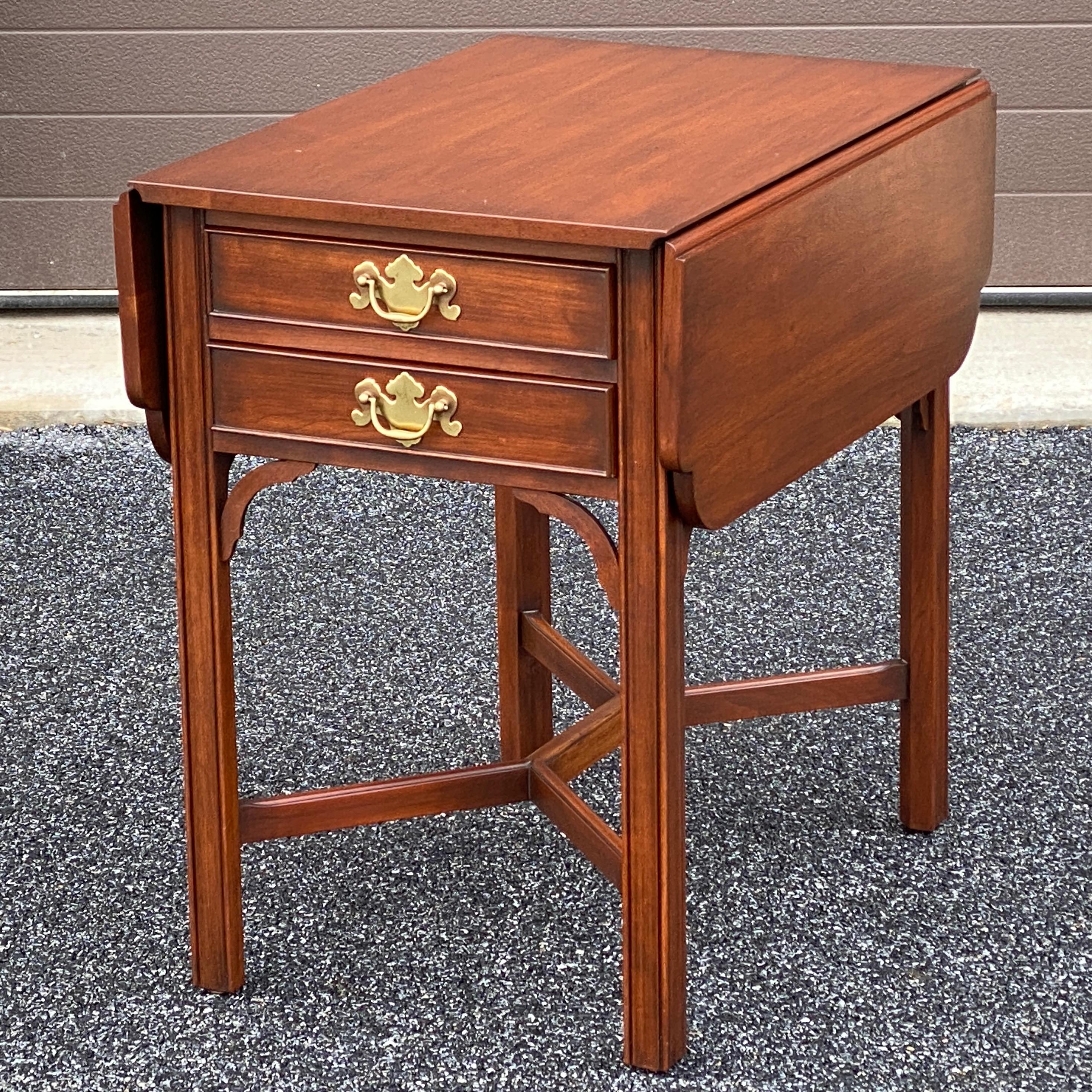 Top quality vintage Henkel Harris Chippendale Solid Wild Black Cherry Drop Leaf Chairside Pembroke Table circa 1981.
Model 5425
Finish 24
35.25”w with both leaves up