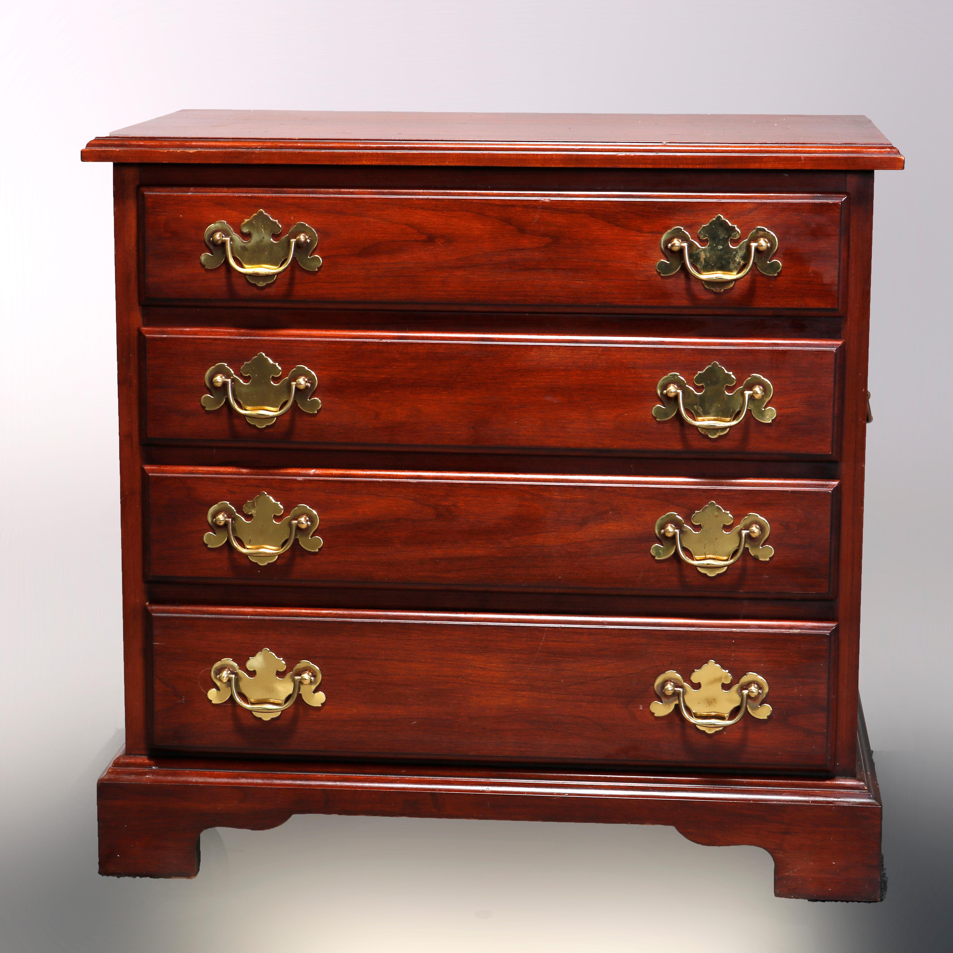 A vintage Chippendale style silver chest by Henkel Harris in the Virginia Galleries line offers black cherry construction with beveled top surmounting case with four graduated drawers and raised on bracket feet, cast brass pulls and handles on