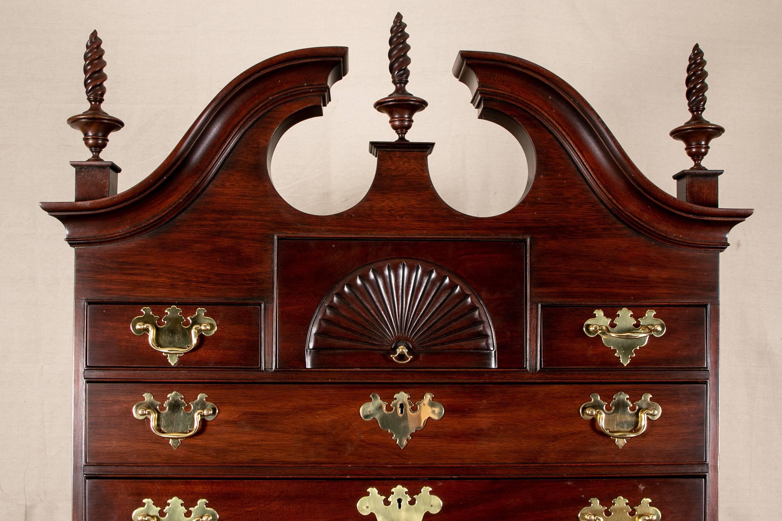 Henkel-Harris Dale high chest, authorized 18th century reproduction by the society for the Preservation of New England Antiquities, mahogany, top portion with broken bonnet top with three barley twist finials flanking each end and in centre, row of