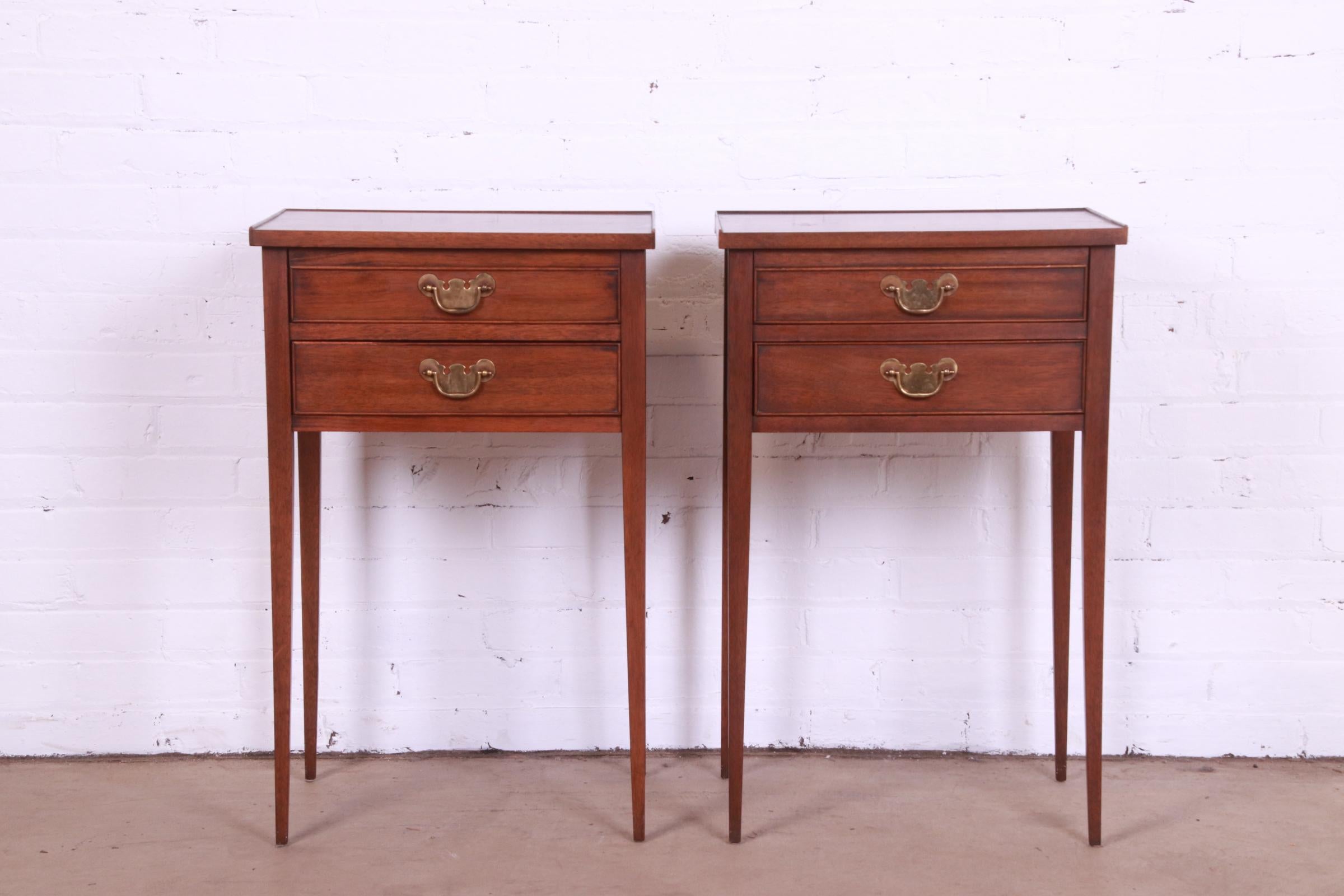 A gorgeous pair of Federal or Hepplewhite style nightstands or end tables

By Henkel Harris

USA, Circa 1980s

Mahogany, with original brass hardware.

Measures: 18.13
