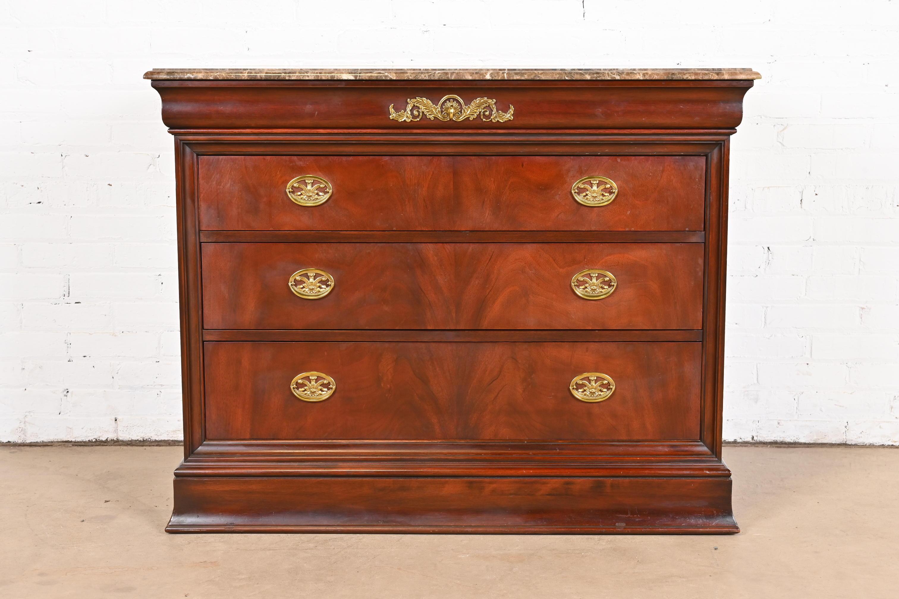 An exceptional French Empire of Louis Philippe style dresser or chest of drawers

By Henkel Harris

USA, 1990s

Stunning book-matched flame mahogany, with beveled marble top, and original brass hardware. Top drawer with felt inserts for
