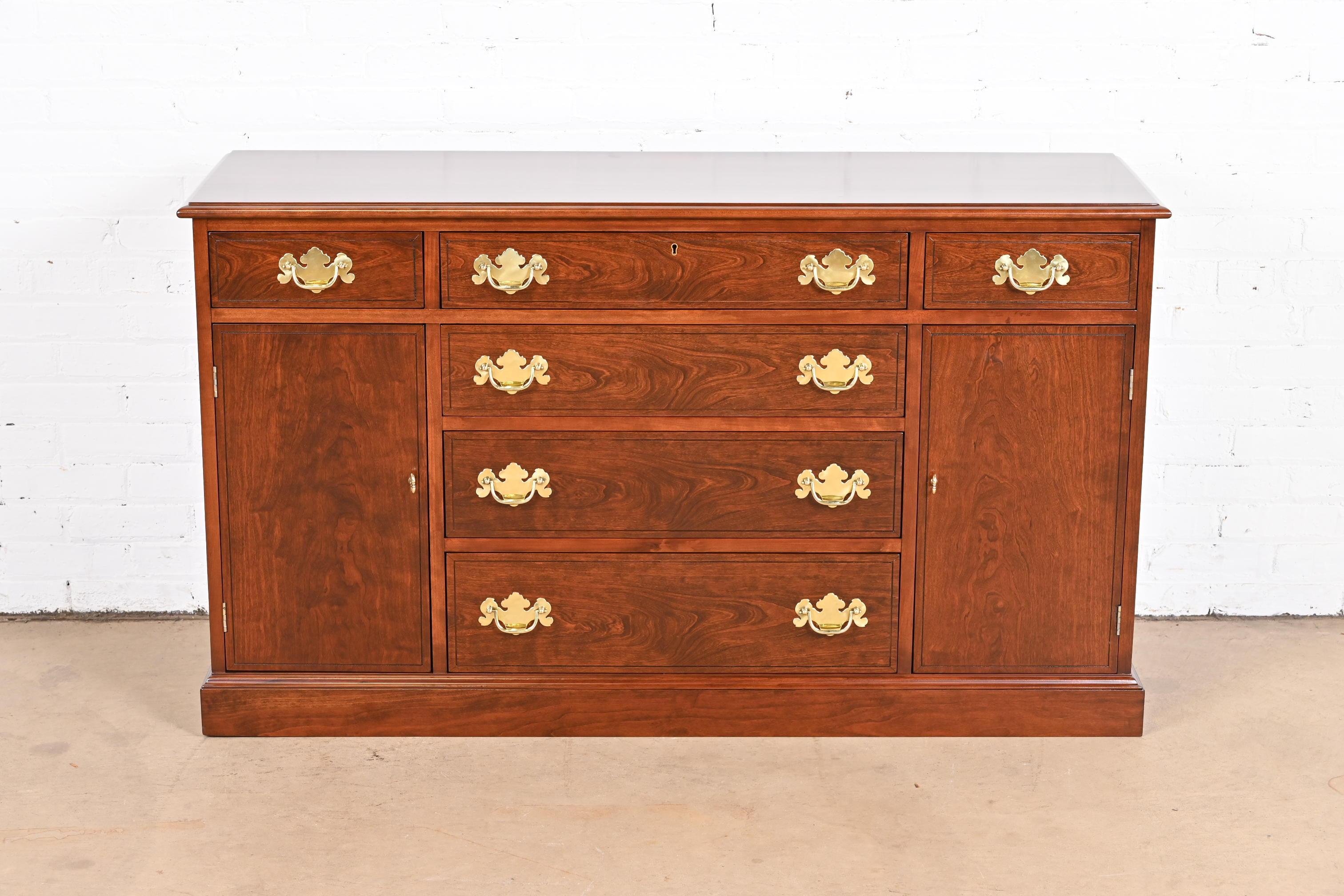 An exceptional Georgian or Chippendale style sideboard, credenza, or bar cabinet

By Henkel Harris

USA, 1977

Gorgeous solid cherry wood, with original brass hardware.

Measures: 55
