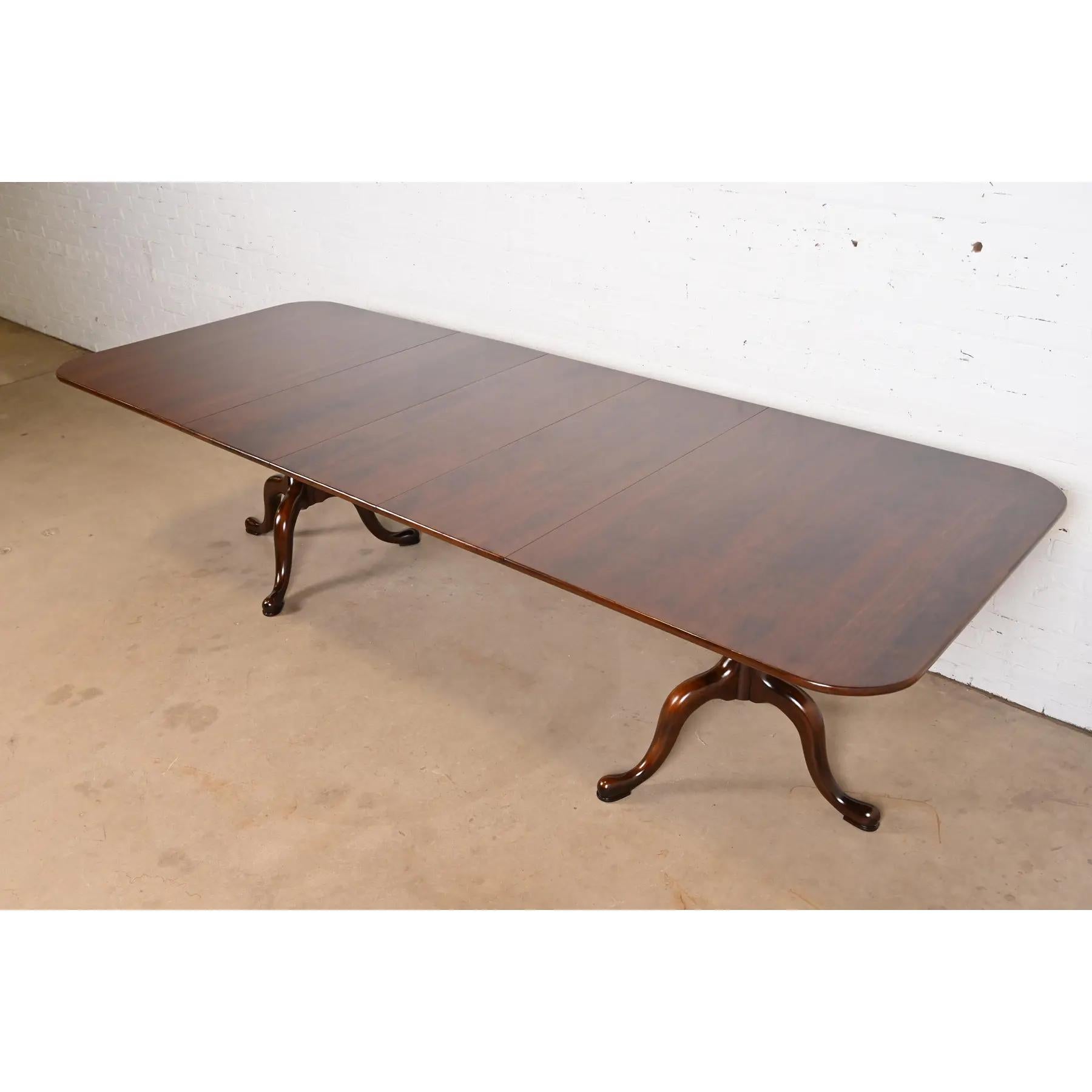 An exceptional Georgian or Regency style solid cherry wood double pedestal extension dining table

By Henkel Harris

USA, 1994

Measures: 66.25