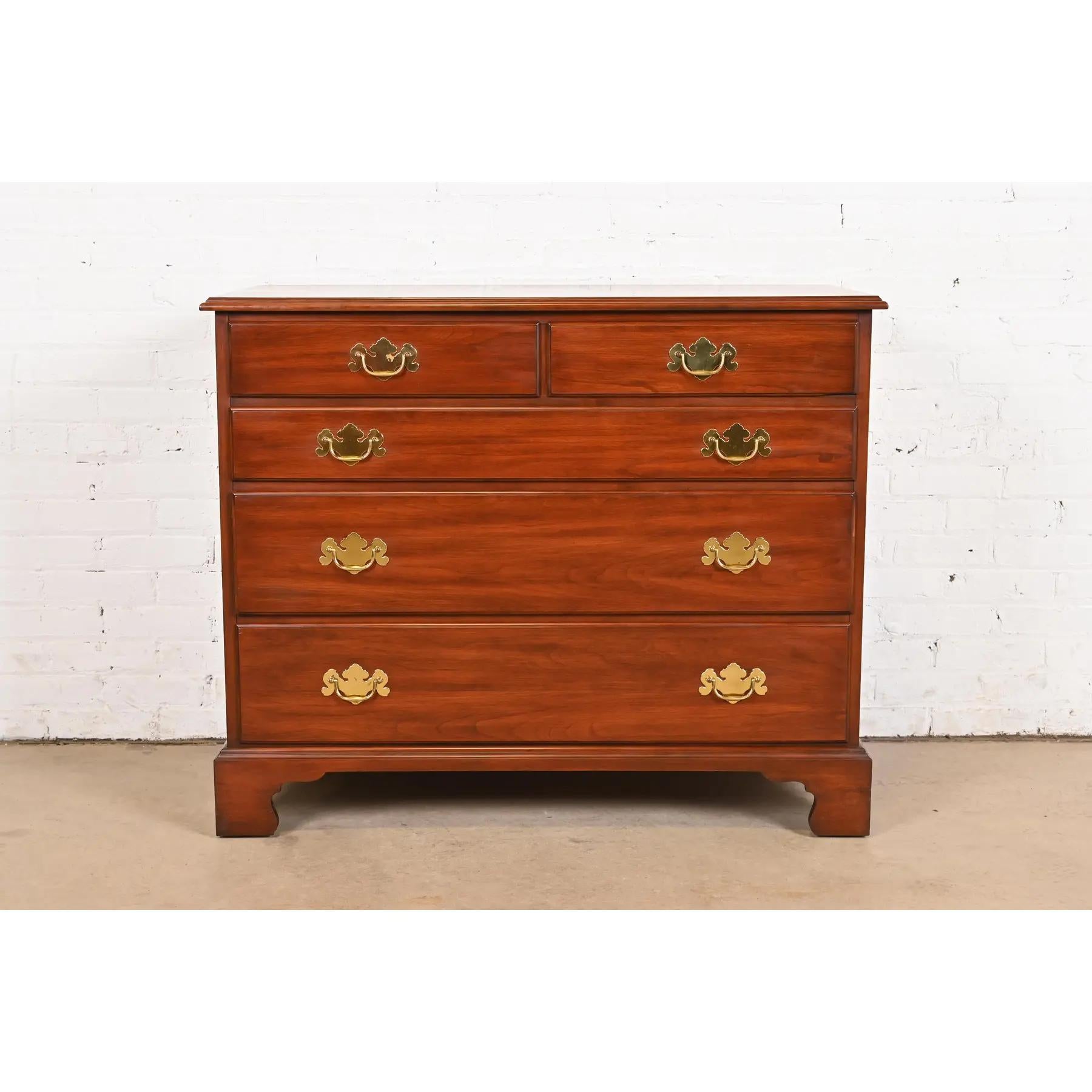 An exceptional Georgian or Chippendale style five-drawer dresser or chest of drawers

By Henkel Harris

USA, 1988

Solid cherry wood, with original brass hardware.

Measures: 42
