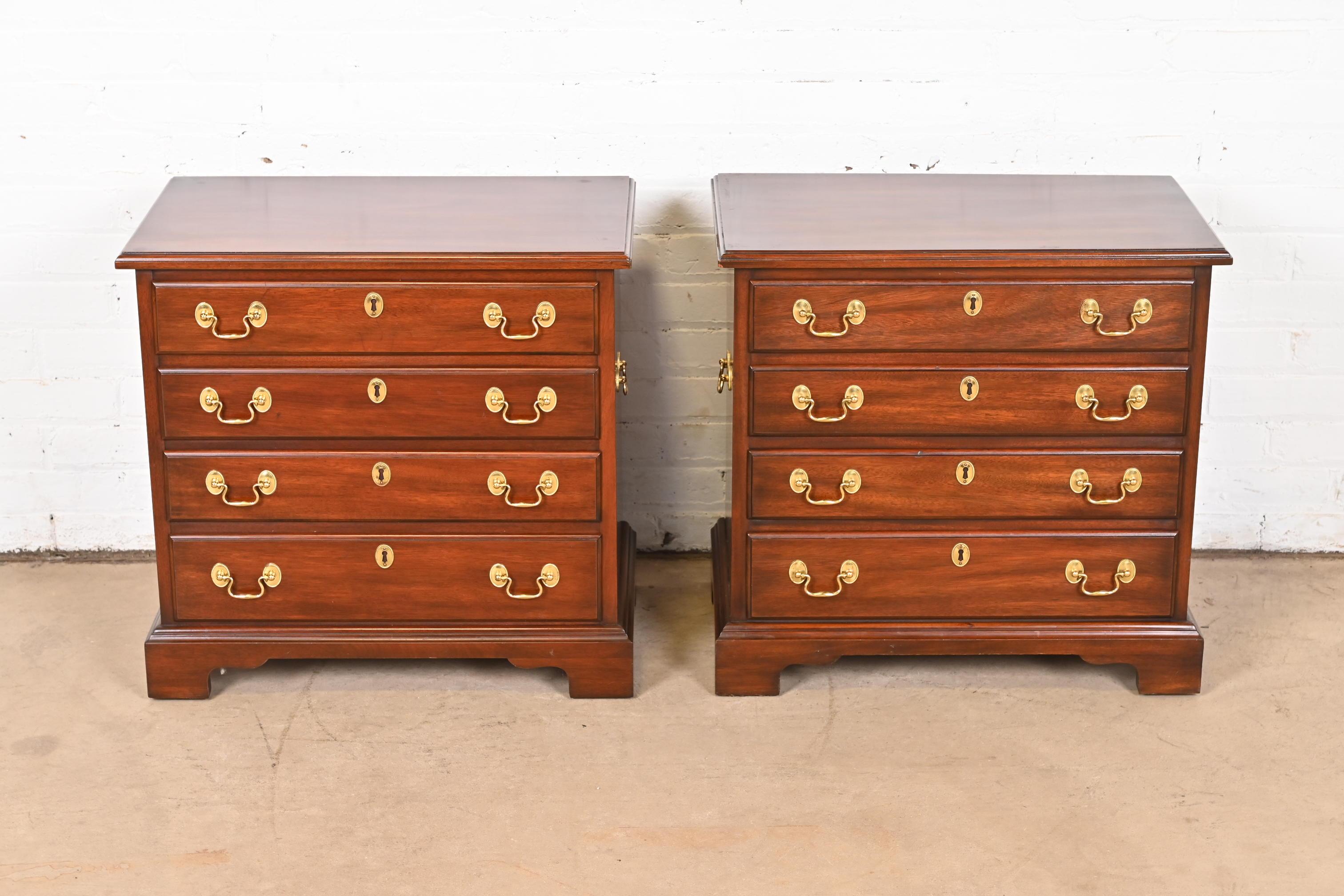 A beautiful pair of Georgian or Chippendale style four-drawer bachelor chests or nightstands

By Henkel Harris

USA, 1987

Solid mahogany, with original brass hardware.

Measures: 24.25
