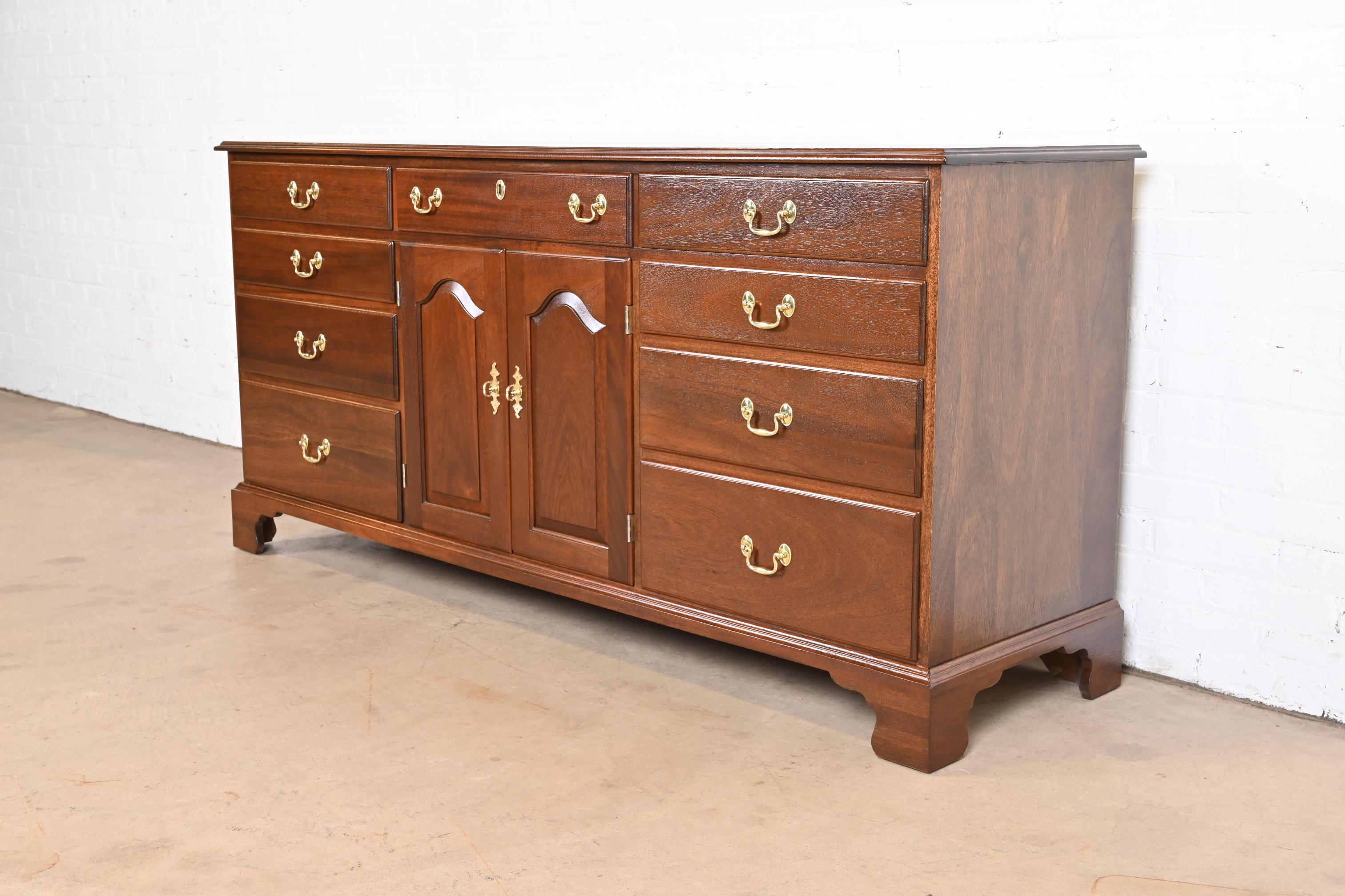 A gorgeous Georgian or Chippendale style dresser or credenza

By Henkel Harris

USA, 1970

Solid mahogany, with original brass hardware.

Measures: 72