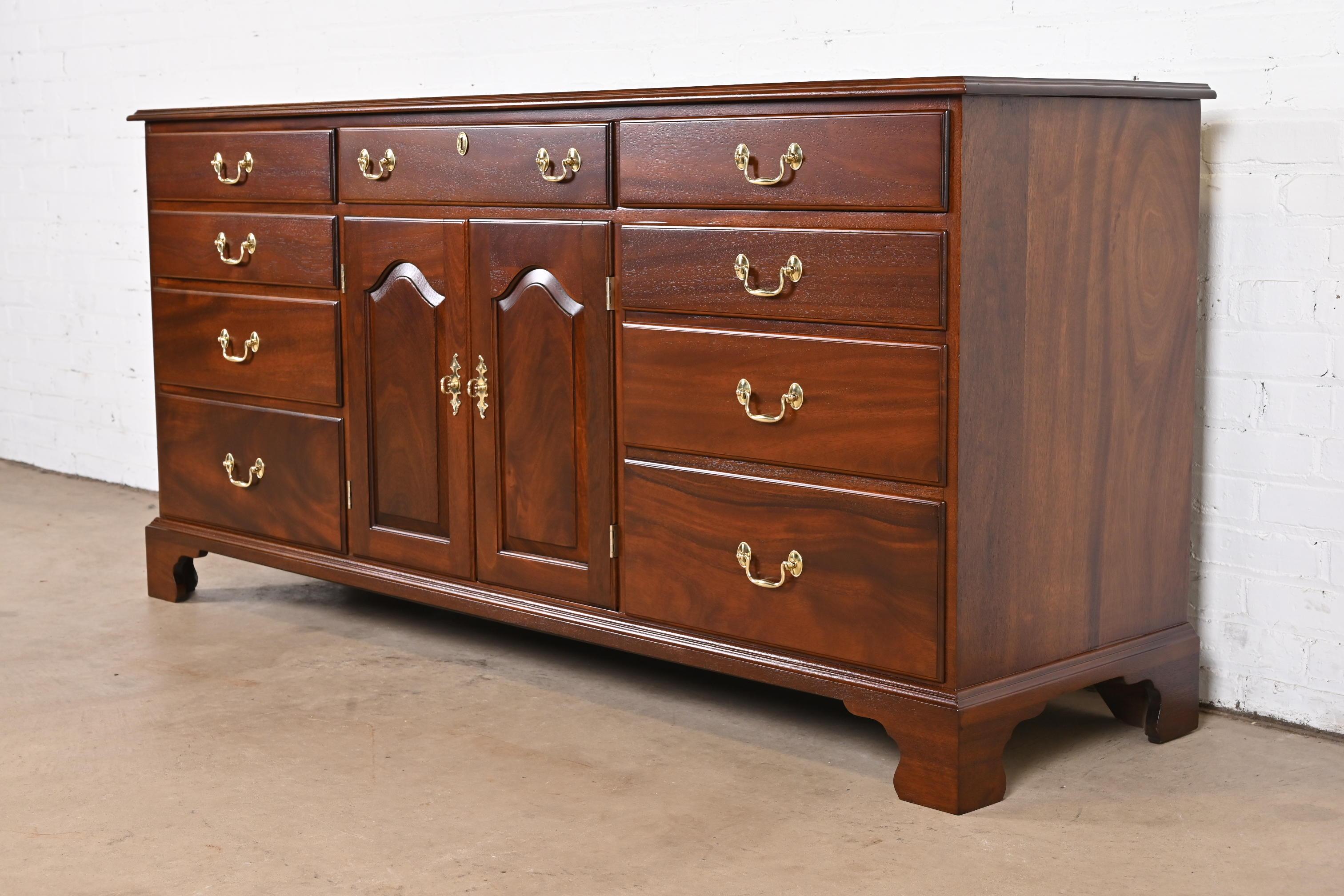 A gorgeous Georgian or Chippendale style dresser or credenza

By Henkel Harris

USA, 1974

Solid mahogany, with original brass hardware.

Measures: 72