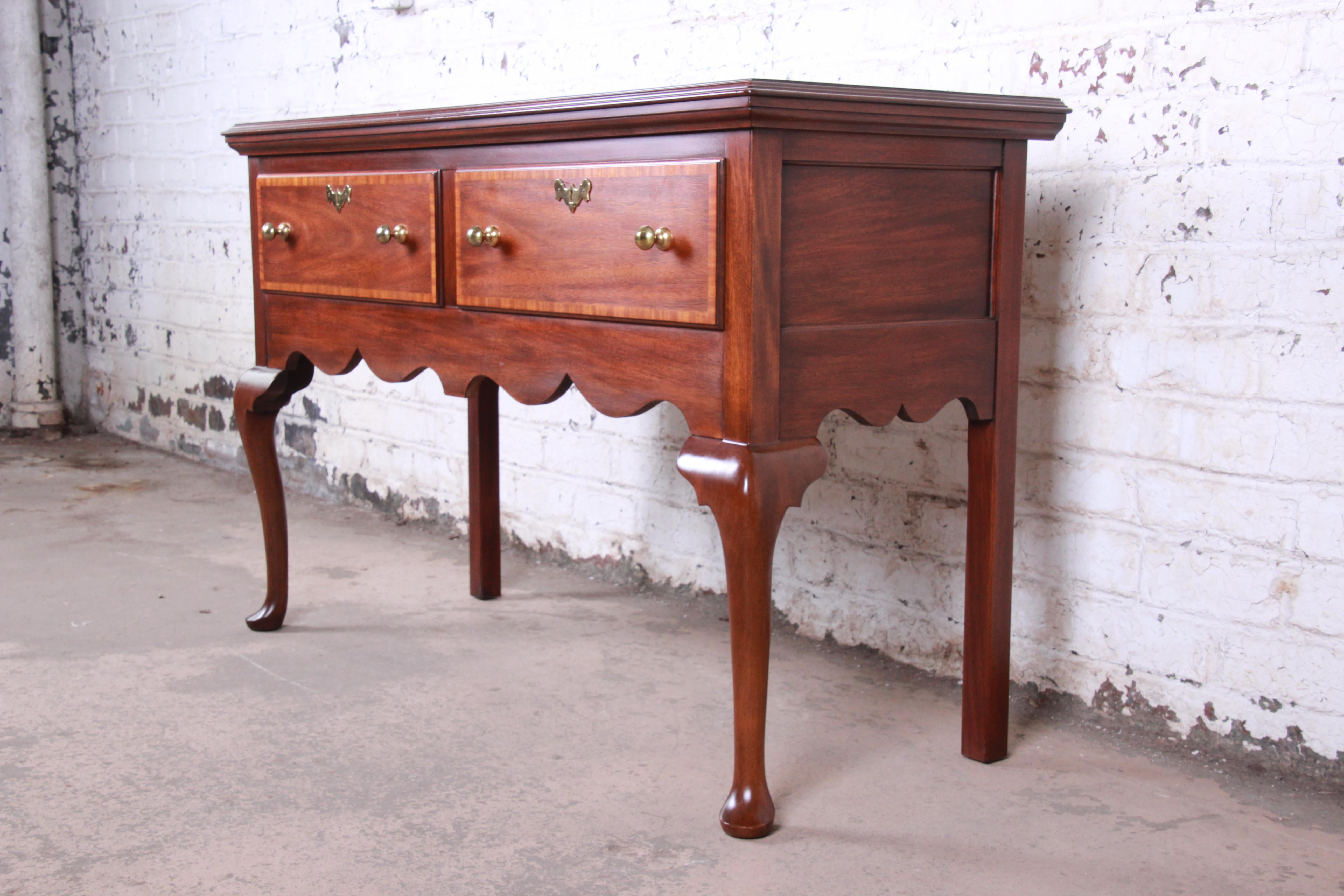 An exceptional Queen Anne style sideboard or buffet server

From the Jamestown Colony collection by Henkel Harris

USA, circa 1980s

Mahogany, with original brass hardware. Both drawers lock, and two original keys are included.

Measures: