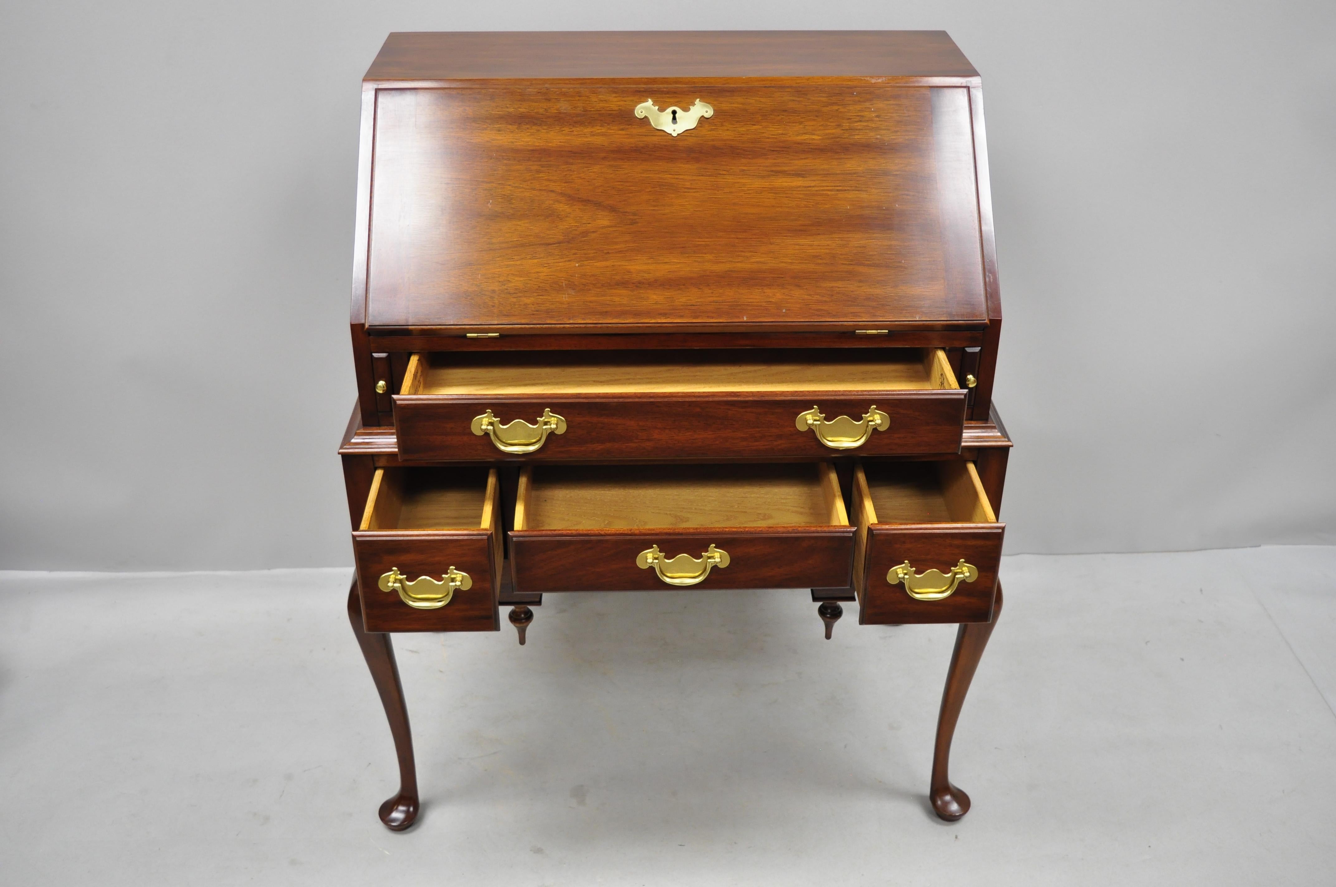 Henkel Harris mahogany Queen Anne style slant front secretary desk. Item features solid wood construction, beautiful wood grain, original label, working lock and key, 4 dovetailed drawers, shapely Queen Anne legs, solid brass hardware, quality