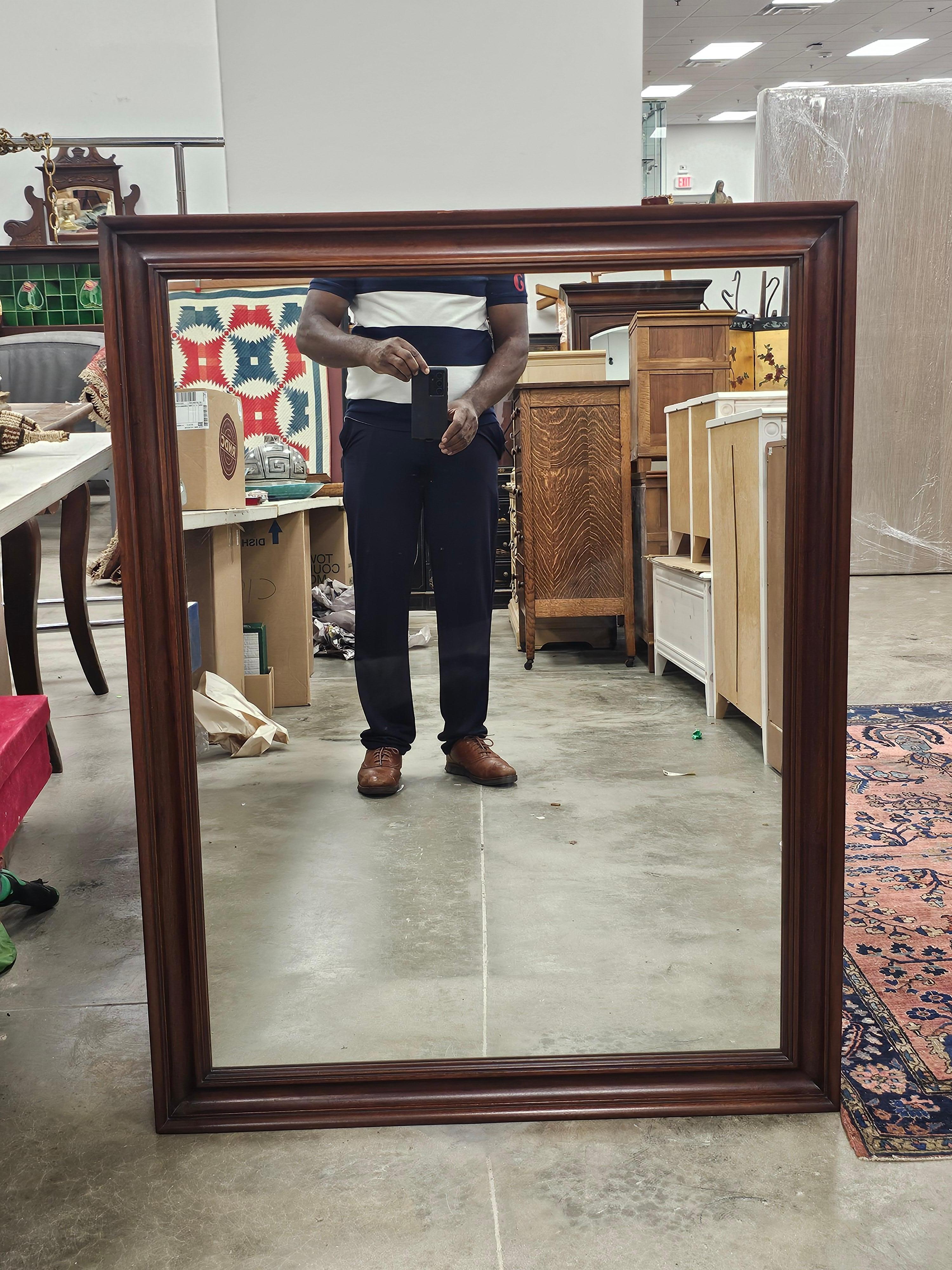 Stained Henkel-Harris Neoclassical Mahogany Framed Wall Mirror For Sale