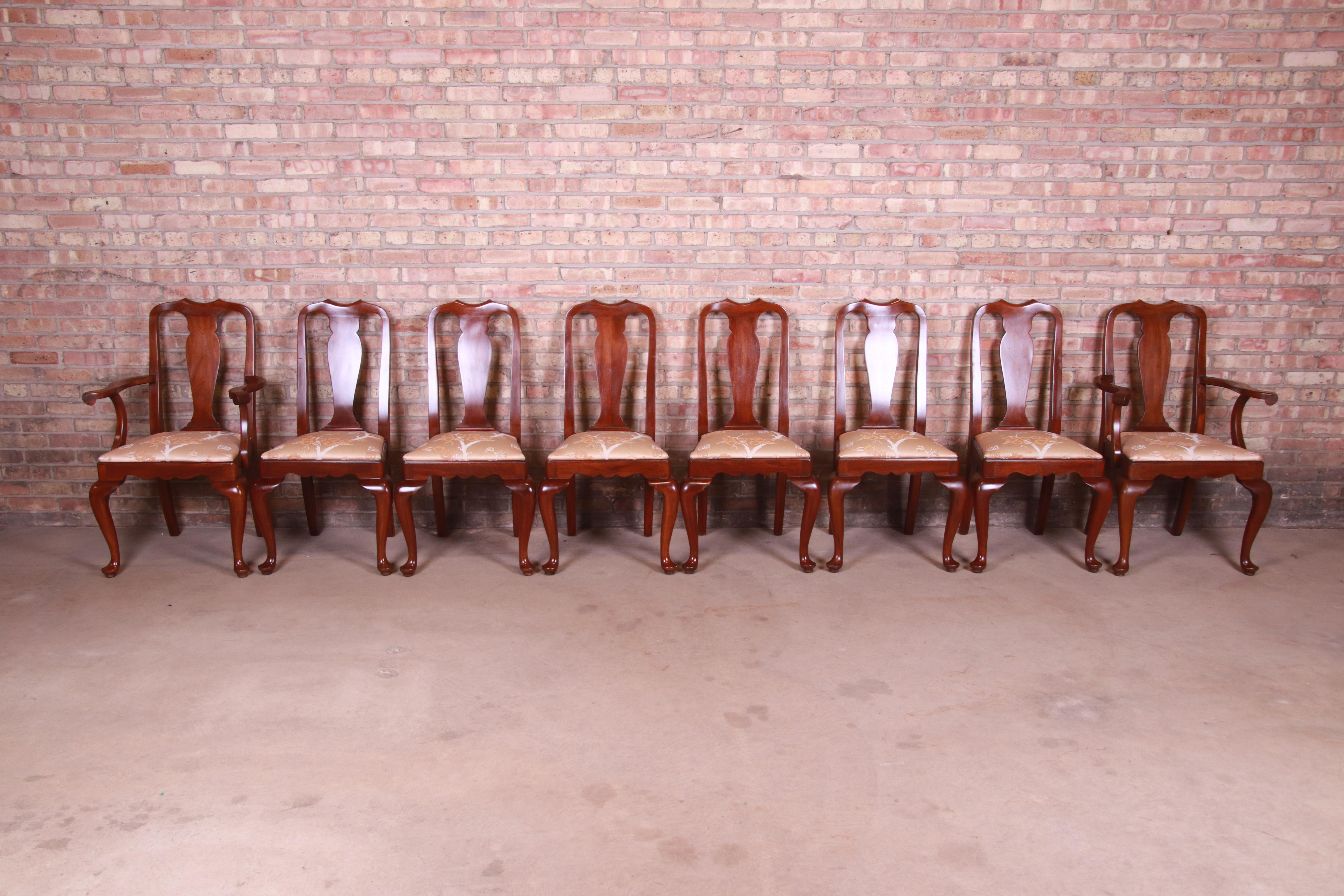 A gorgeous set of eight Queen Anne style dining chairs

By Henkel Harris

USA, circa 1980s

Carved mahogany, with original Asian-inspired upholstered seats.

Armchairs measure: 24.5