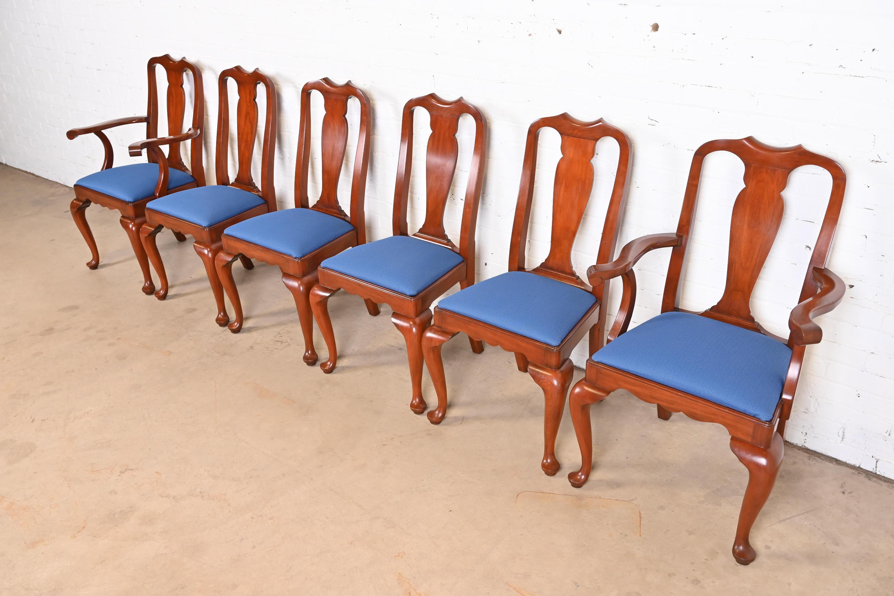 A gorgeous set of six Queen Anne style dining chairs

By Henkel Harris

USA, Circa 1980s

Solid cherry wood frames, with blue upholstered seats.

Measures:
Side chairs - 20.75
