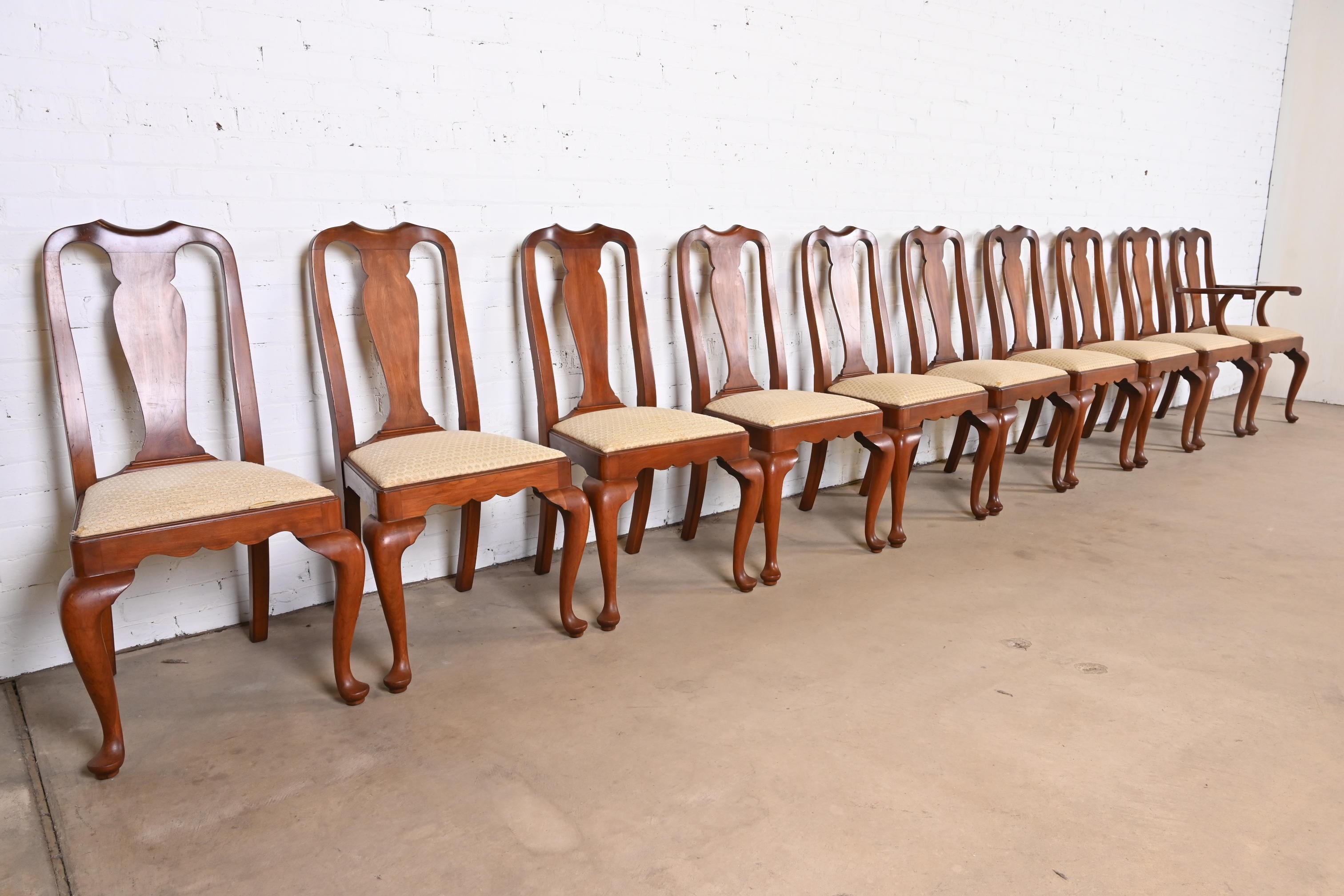 An outstanding set of ten Queen Anne style dining chairs

By Henkel Harris

USA, circa 1980s

Solid cherry wood frames, with upholstered seats.

Measures:
Side chairs - 21