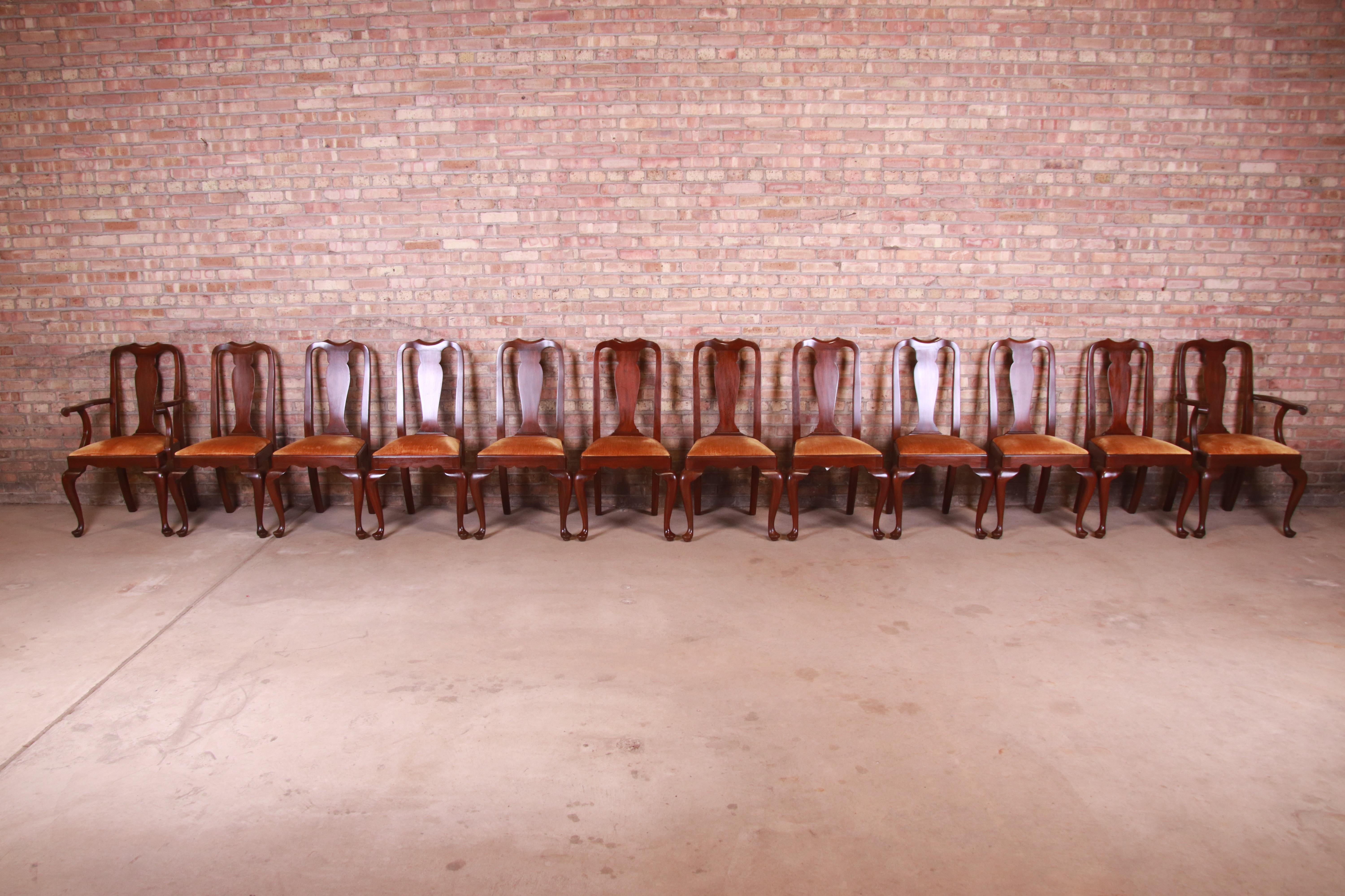 An outstanding set of twelve Queen Anne style dining chairs

By Henkel Harris

USA, Circa 1980s

Solid mahogany frames, with velvet upholstered seats.

Measures:
Side chairs - 20.5