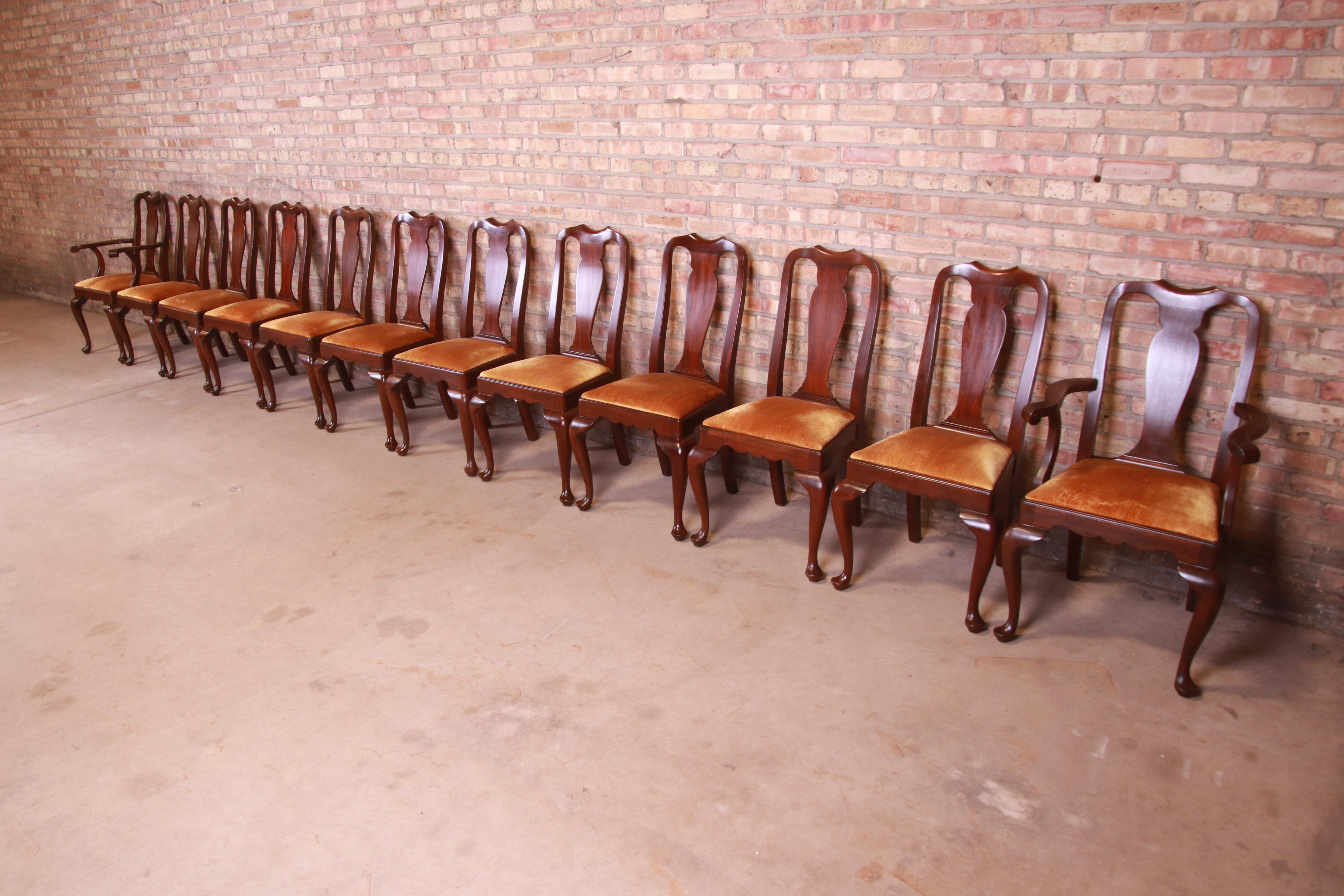 An outstanding set of twelve Queen Anne style dining chairs

By Henkel Harris

USA, Circa 1980s

Solid mahogany frames, with velvet upholstered seats.

Measures:
Side chairs - 20.5