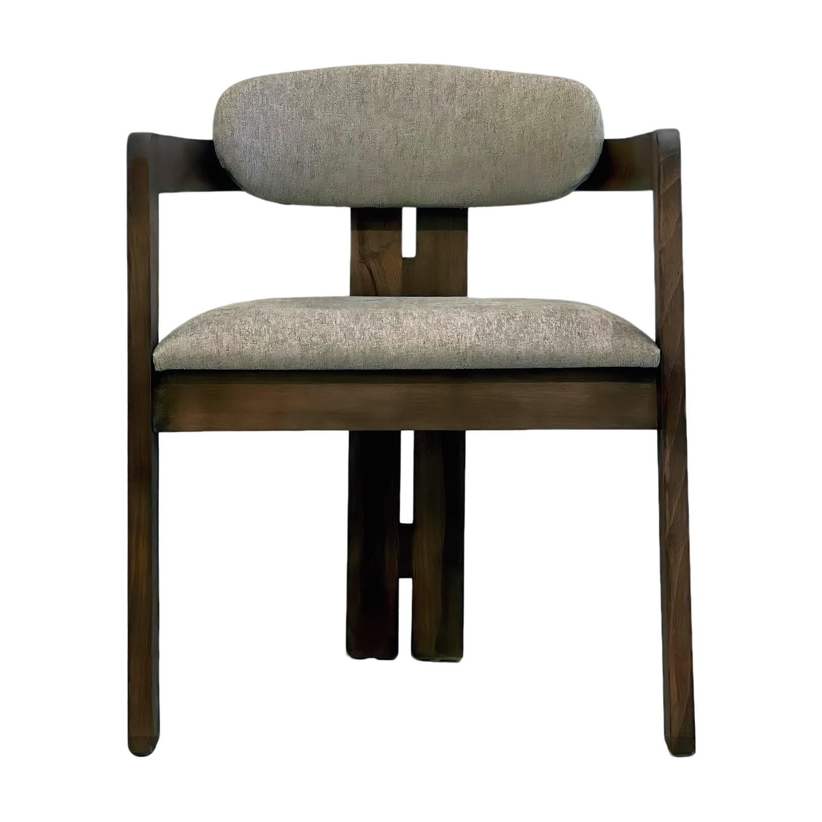 Henley Curve back arm chair with upholstered seat and back. Elegant dining chair with stunning modern silhouette.
Chair comes upholstered in COM. Standard in Walnut as shown, Oak or Pine. Customizable.