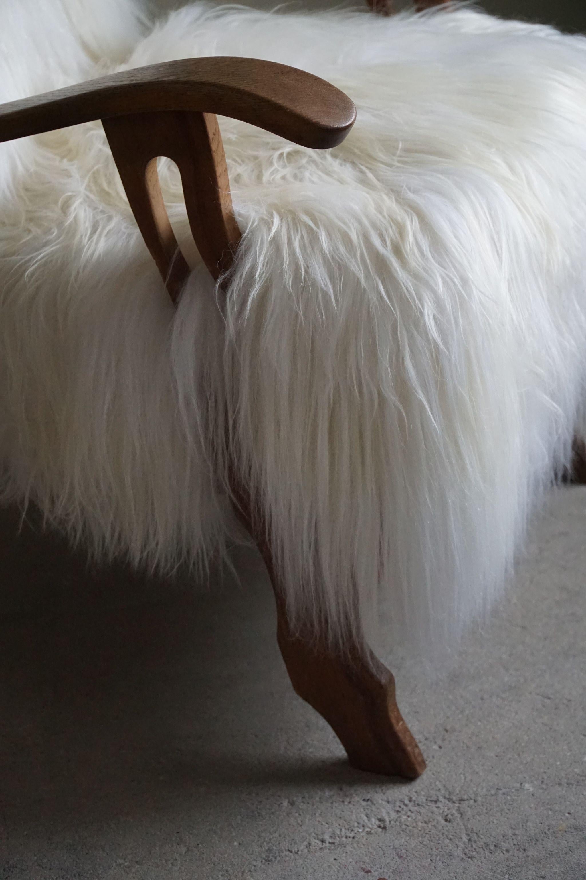 Hand-Crafted Henning Kjærnulf, Armchair Reupholstered in Longhaired Icelandic Sheepskin, 1950 For Sale