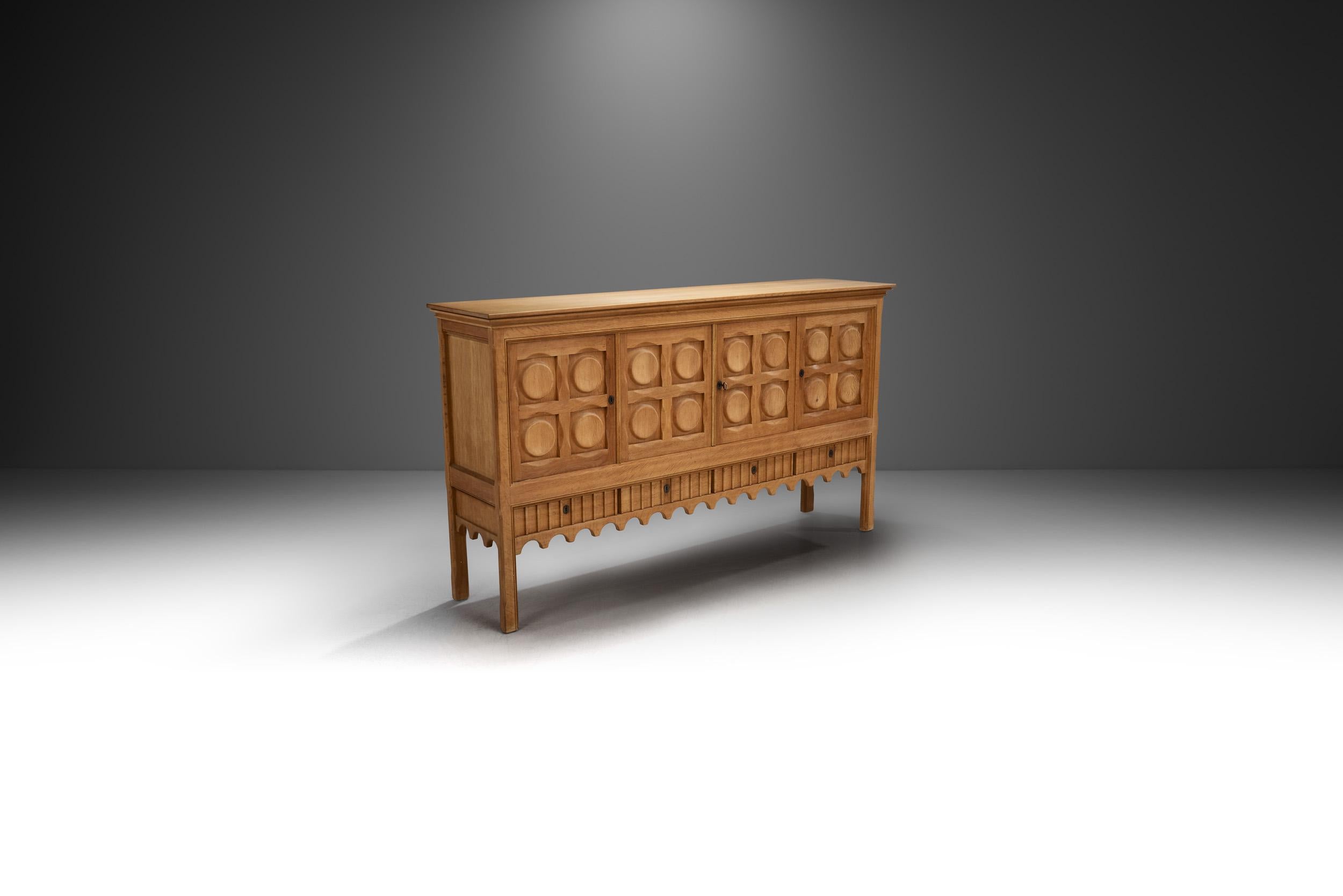 Featuring Danish designer, Henning Kjærnulf’s distinctive scallop motif, this sideboard melds seamlessly with any style thanks to its elegant sense of whimsy. The oak form is elemental, enhanced by the sculptural carvings.

The evolution of