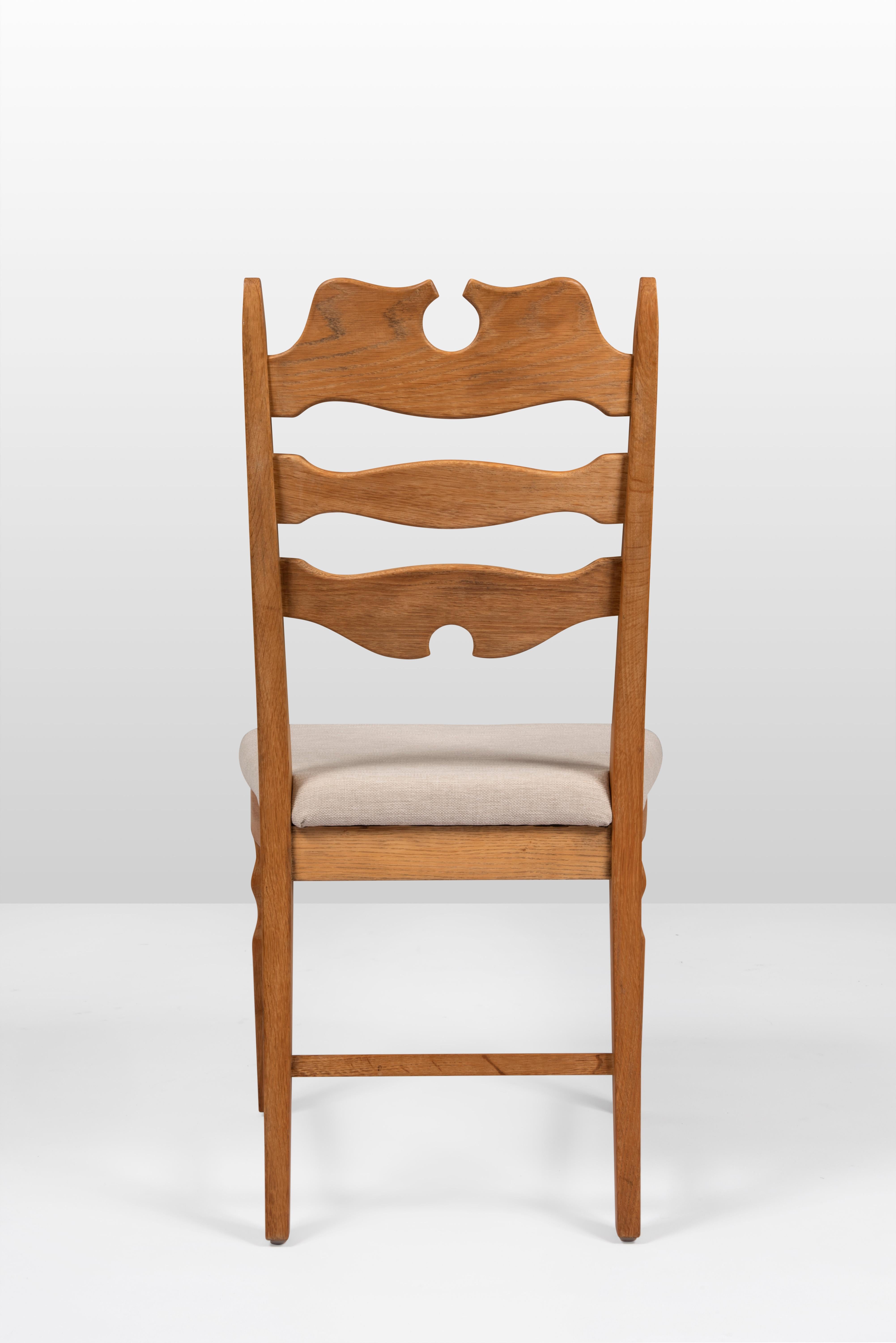 Henning Kjærnulf oak dining chairs reupholstered in a toile chinée. Nice and pure. Made by EG Möbler in 1960's.