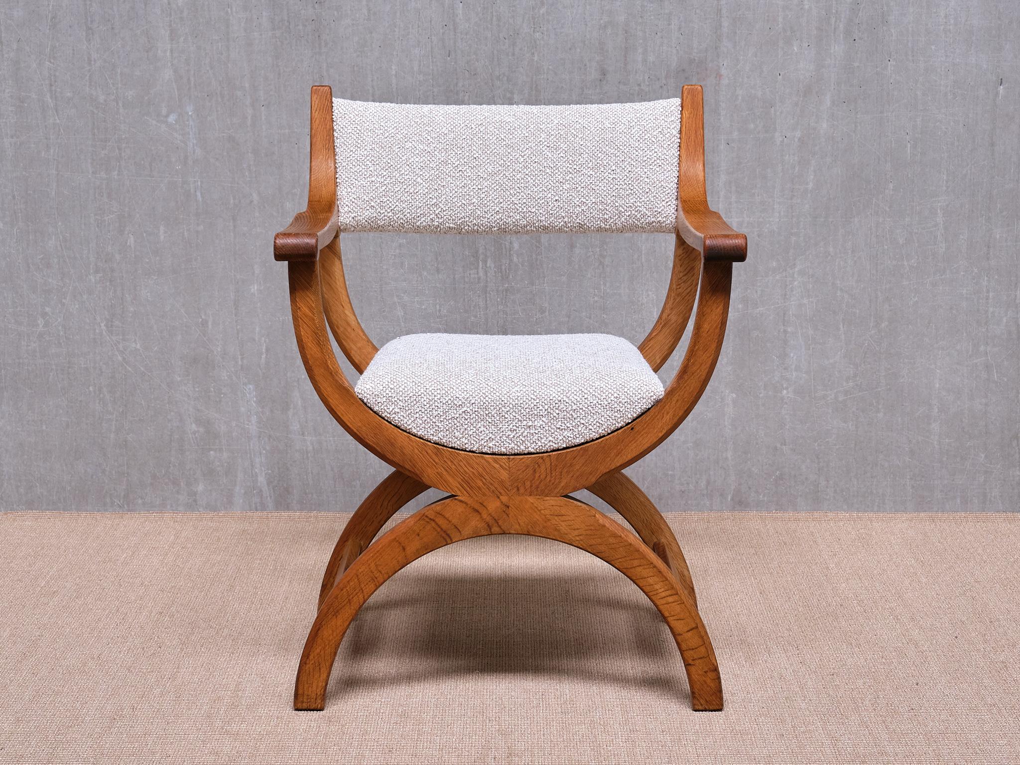 This striking armchair was designed by Henning (Henry) Kjærnulf in the 1960s. This particular model, named Kurul, was produced by EG Kvalitetsmøbel in Denmark. The chair bears the manufacturer's label on the inside of the frame.

Crafted from solid