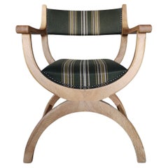 Henning Kjærnulf Kurul chair in solid oak. EG Kvalitetsmøbel Denmark 1960s.