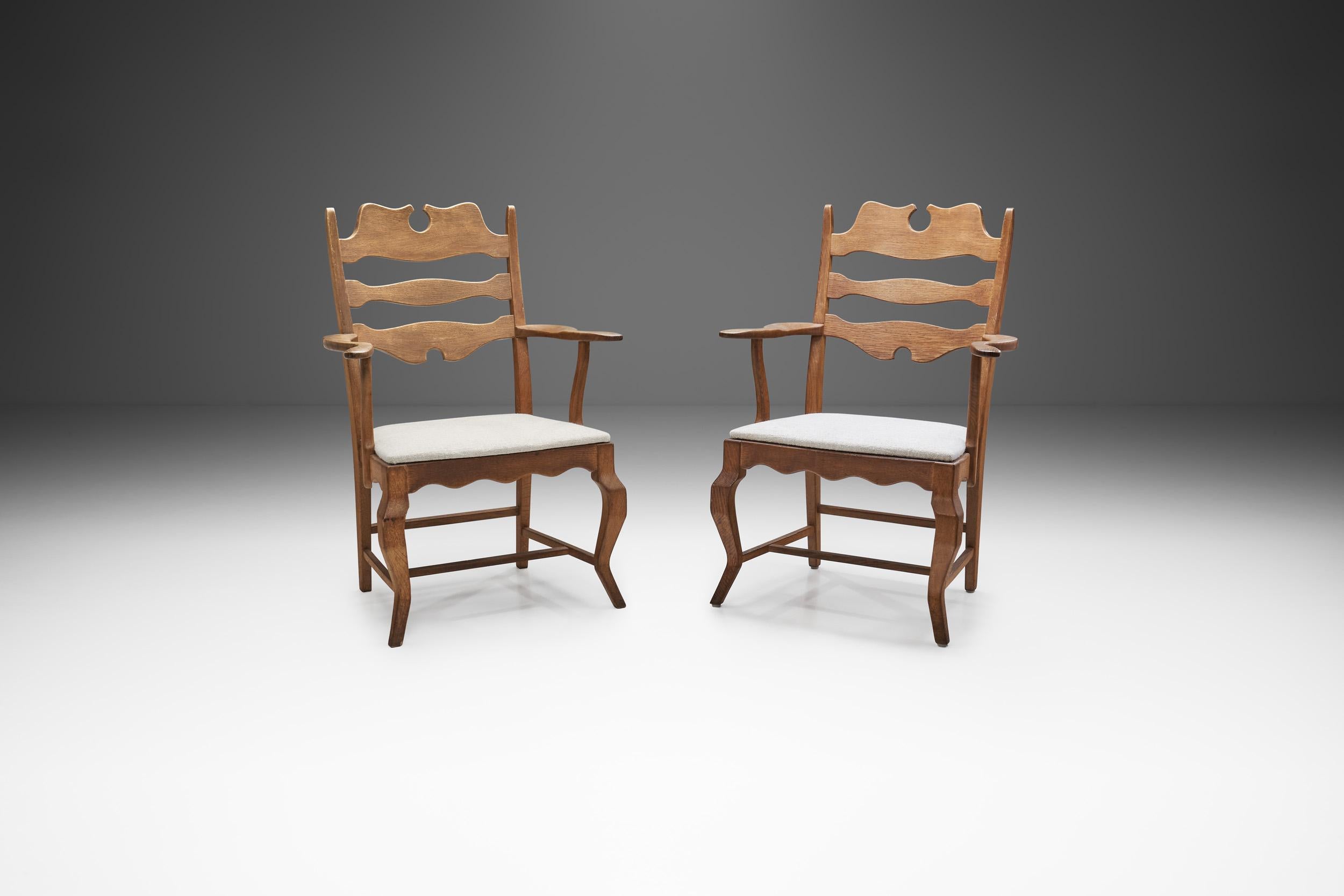 This impressive pair of mid-century dining chairs is representative of the fundamental axioms of Scandinavian design that revolve around quality and functionality and pairs it with a distinctive design.

These chairs belong to Kjærnulf’s so-called