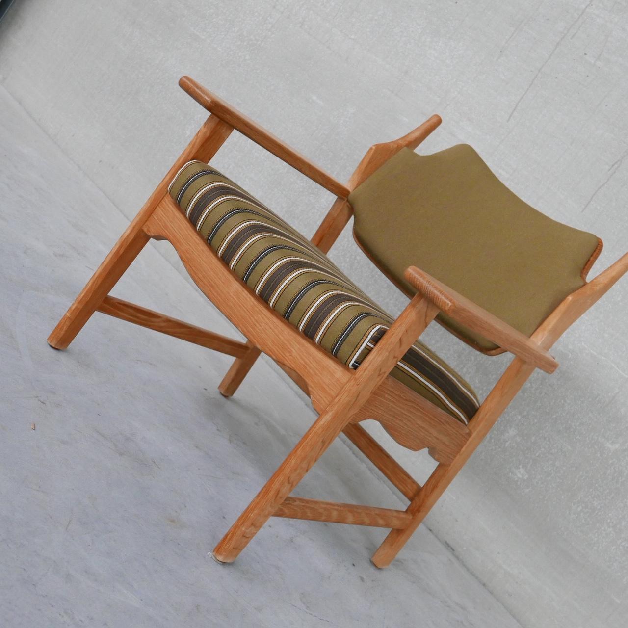 A scarce armchair by Henning Kjaernulf. 

Denmark, c1960s. 

Unusual upholstered model. 

Razor back or razor blade model which is a nod to the back rest. 

Original upholstery which remains in good condition. These also look great in