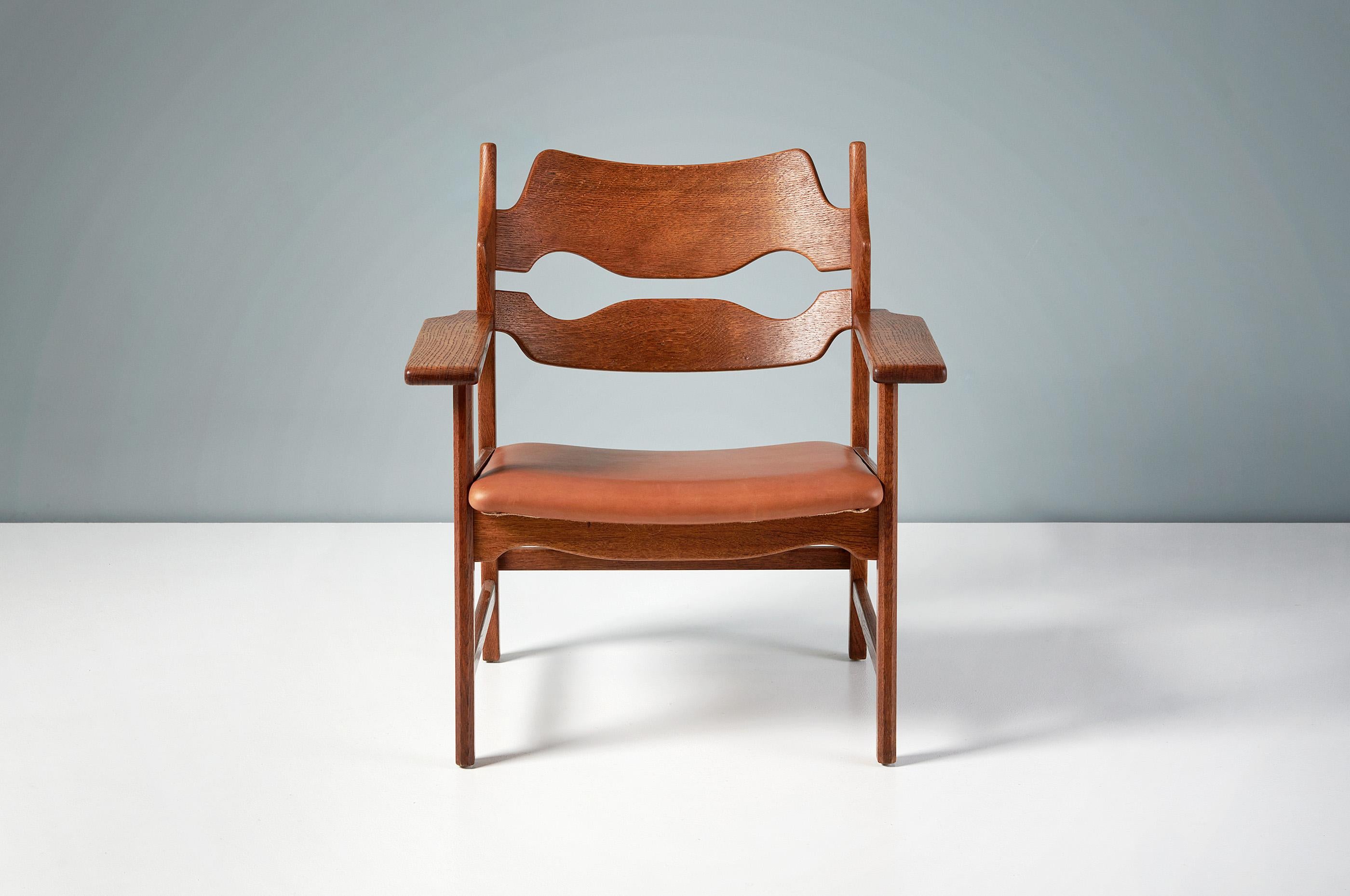 Henning Kjaernulf - Razor Blade Chair, 1960

Unique lounge chair manufactured by Nyrup Møbelfabrik, Denmark 1960. The chair features razor blade shaped carved backs and thick, wide arms all made from oiled, patinated oak. The seat has been