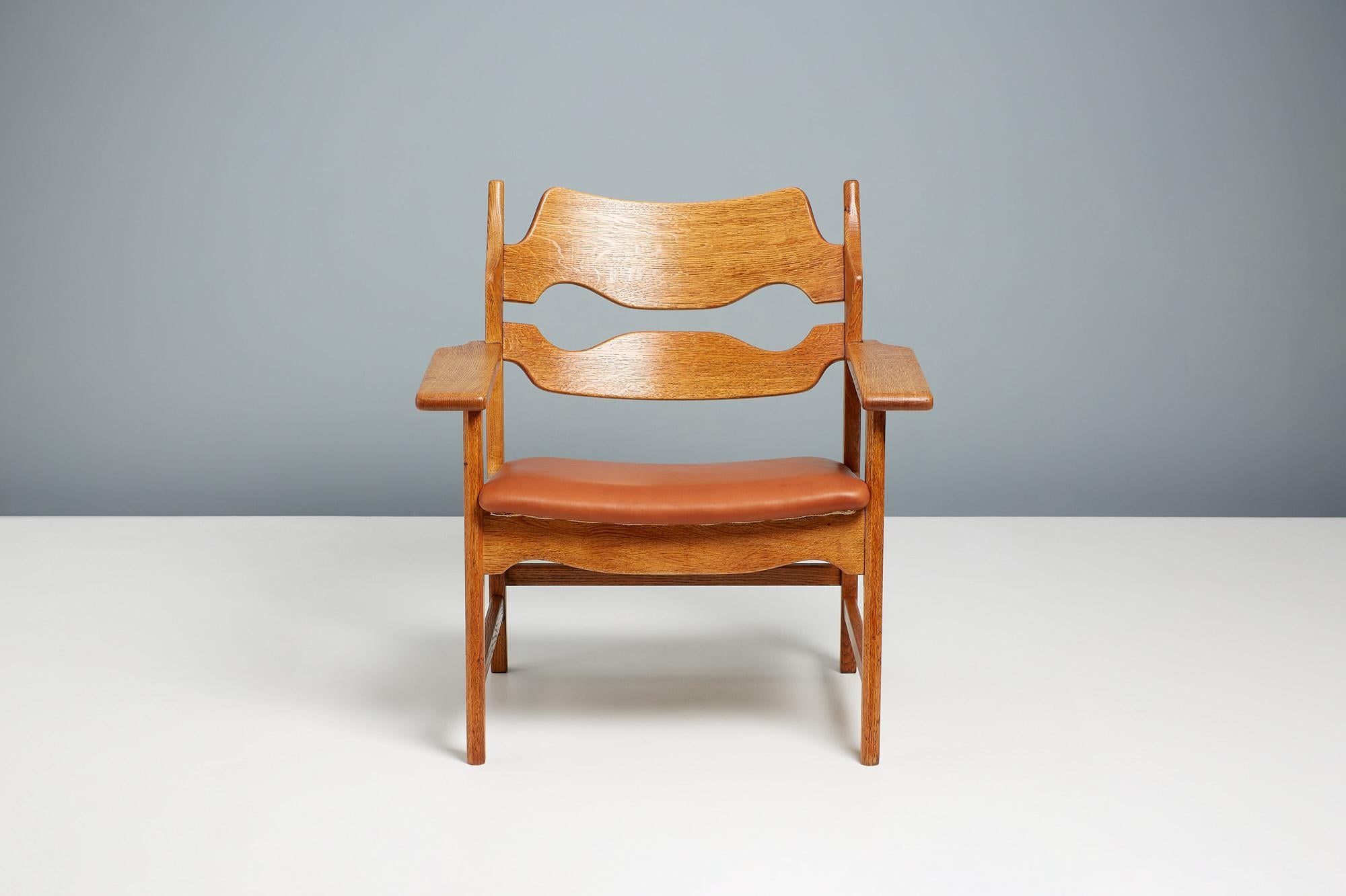Henning Kjaernulf - Razor Blade chairs, 1960

Unique lounge chairs manufactured by Nyrup Møbelfabrik, Denmark 1960. The chair features razor blade shaped carved backs and thick, wide arms all made from oiled, patinated oak. Seats upholstered in
