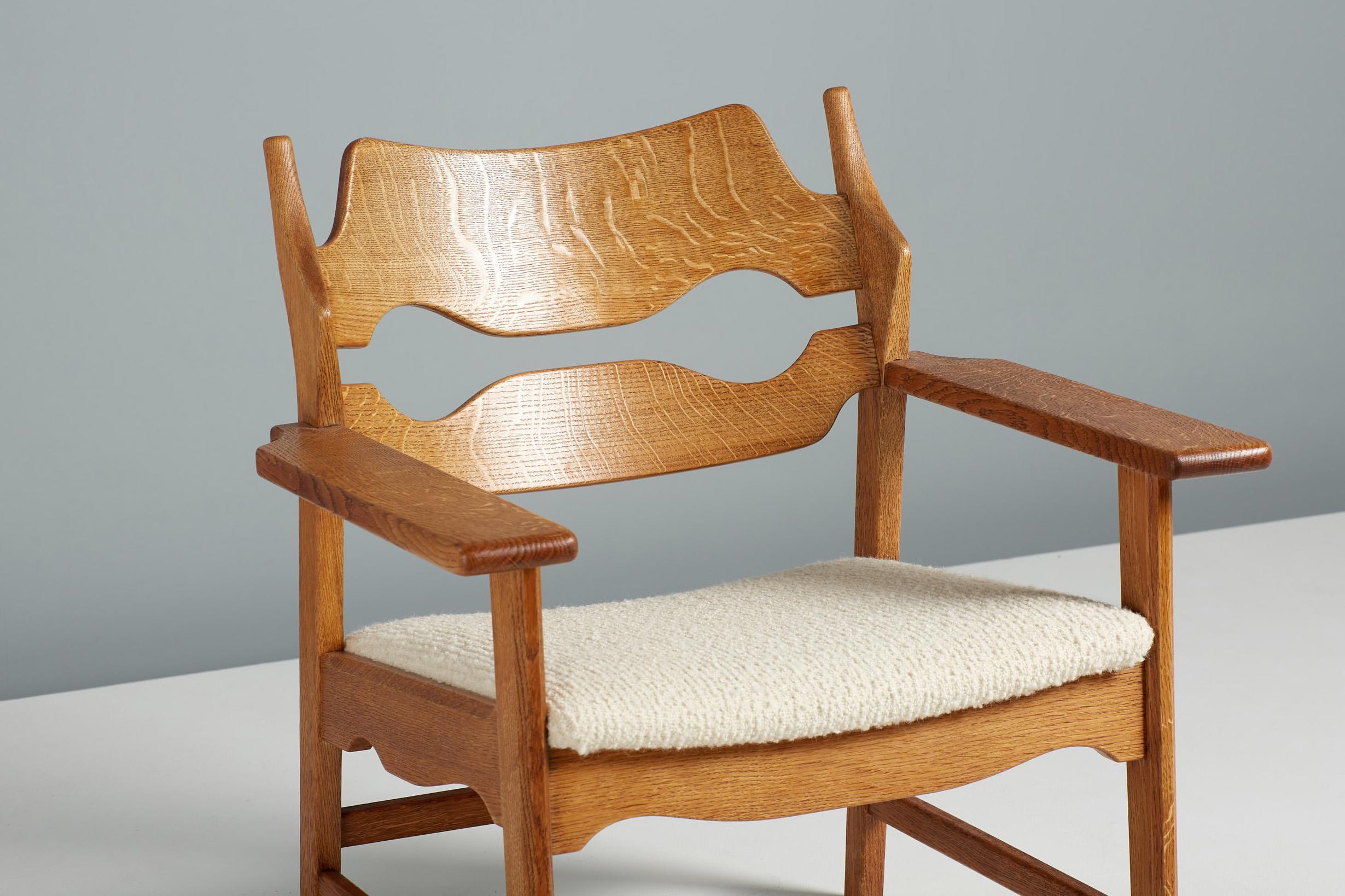 Henning Kjaernulf - razor blade chairs, 1960.

Unique lounge chairs manufactured by Nyrup Møbelfabrik, Denmark 1960. The chairs feature razor blade shaped carved backs and thick, wide arms all made from oiled, patinated oak. The seats have been