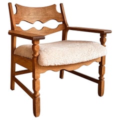 Henning Kjærnulf Razor Blade Lounge Chair reupholstered in White Lamb Skin.