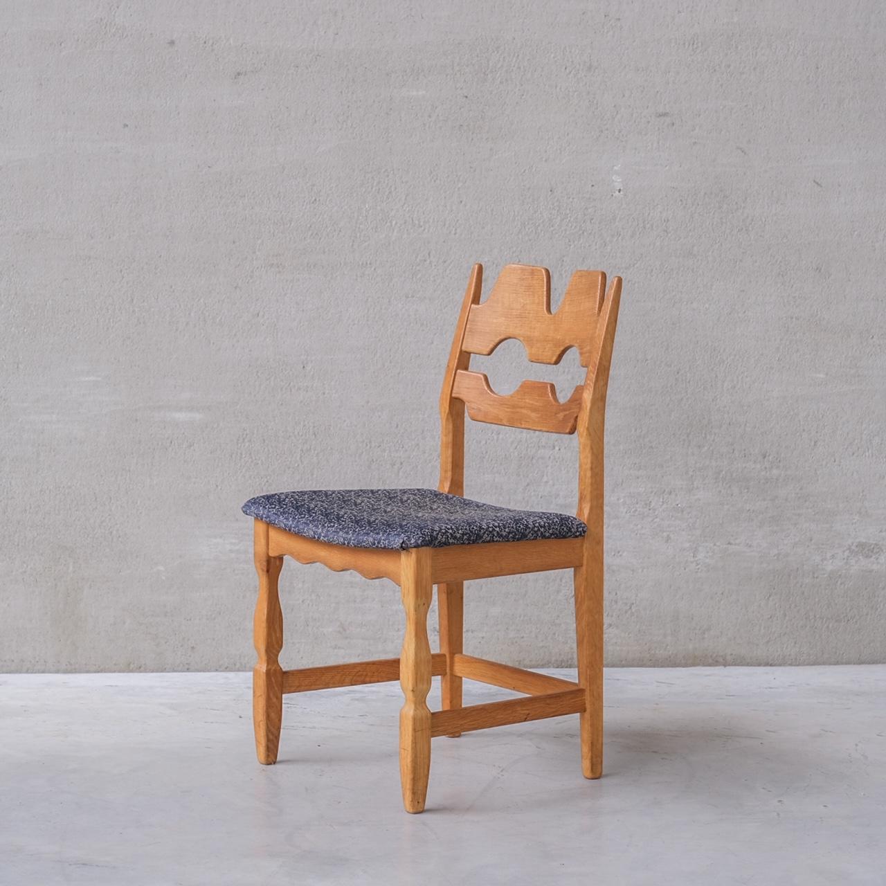 Oak dining chairs by Henning Kjaernulf. A set of four. 

Denmark, c1960s.

'Razor back' or 'Razor blade' model.

Original patina and finish.

Original upholstery has been retained but normally has signs of use and age. We can update these