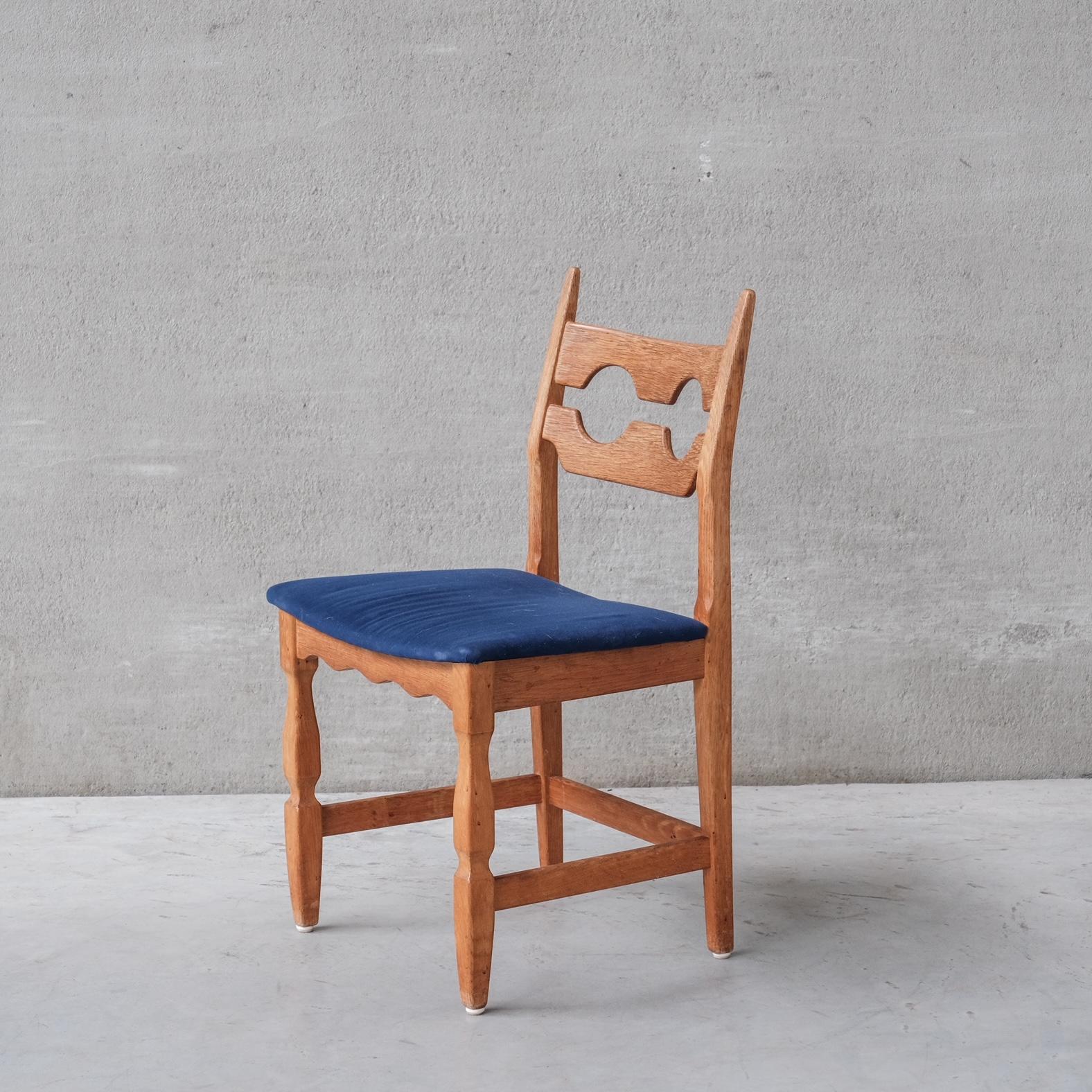 Oak dining chairs by Henning/Henry Kjaernulf. 

Denmark, circa 1960s. 

'Razor back' or 'Razor blade' model. 

A more rare model with straight central backs. 

Good condition for the wood, some wear and scuffs commensurate with age. 

The