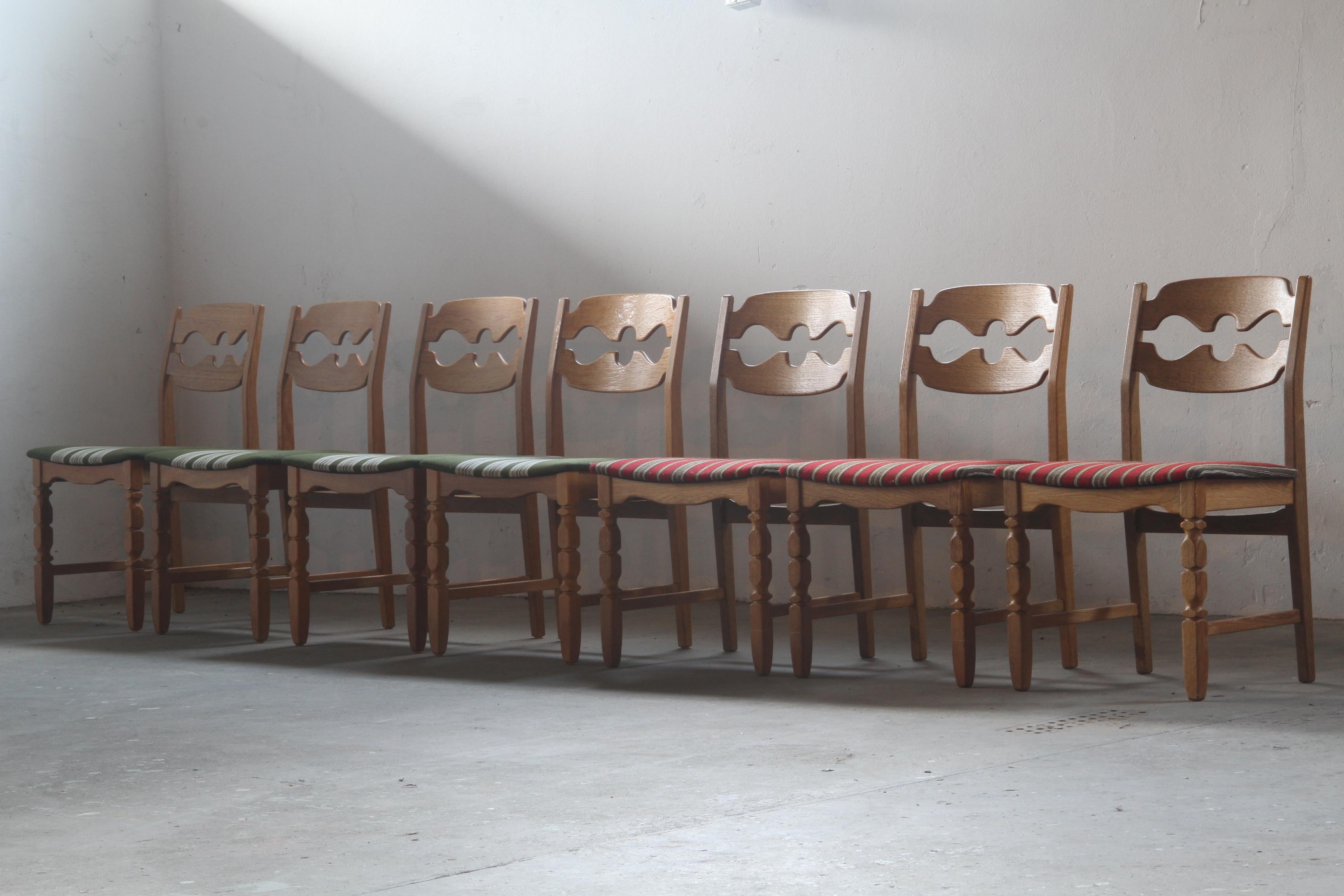 Henning Kjærnulf's striking dining chairs, crafted from oak and showcase a captivating blend of brutalist/Baroque and Mid-Century Modern influences. Known as the Razorblade model, these classic chairs were produced by Nyrup Møbelfabrik during the