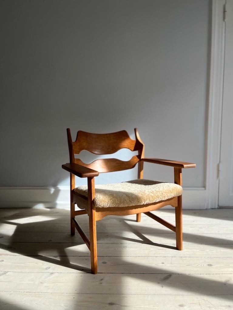 Scandinavian Modern Henning Kjærnulf Razorblade lounge chair reupholstered in honey colored wool