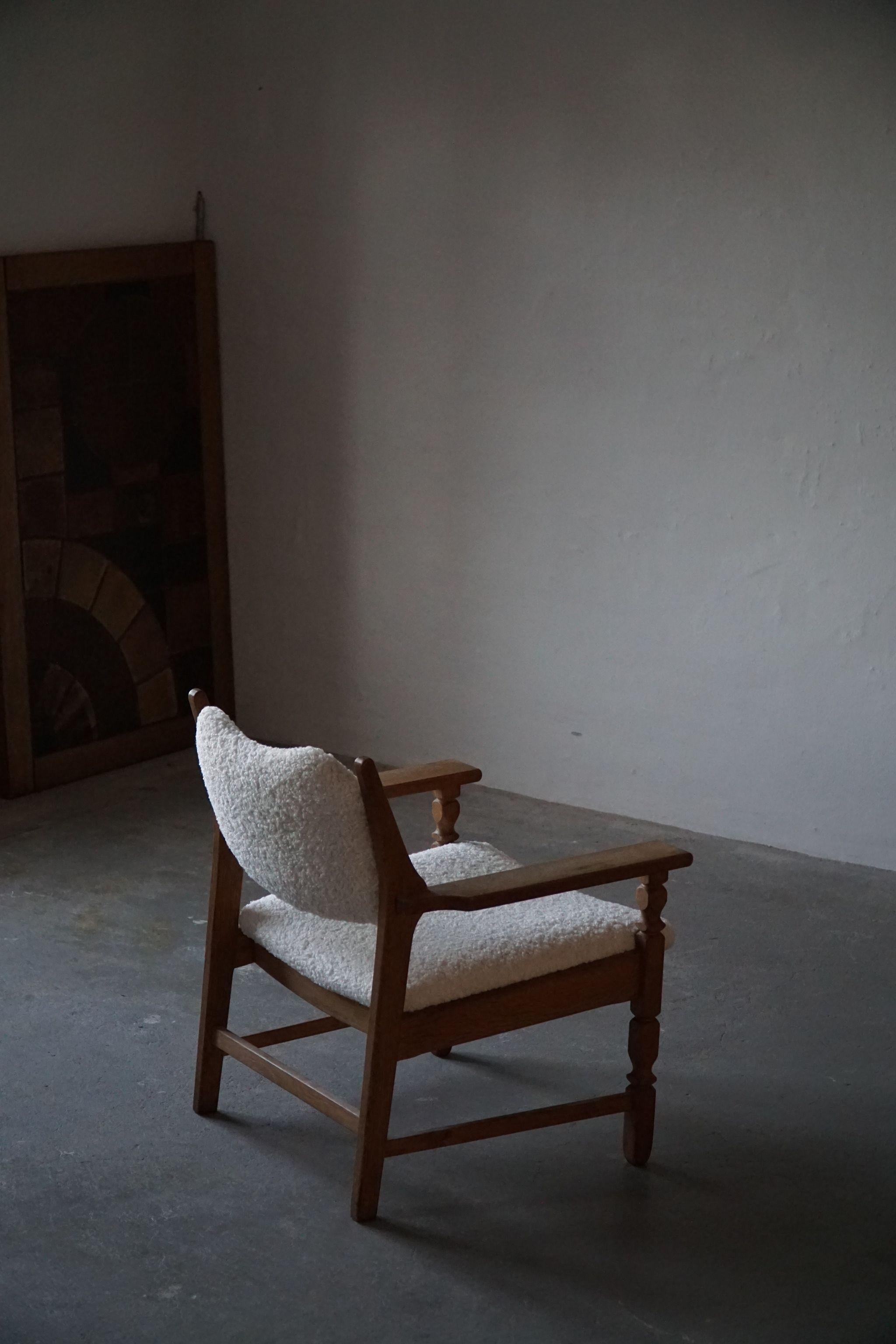Rare carved lounge chair in solid oak. Designed by Henning Kjaernulf for EG Kvalitetsmøbel, Denmark 1950s. Model 