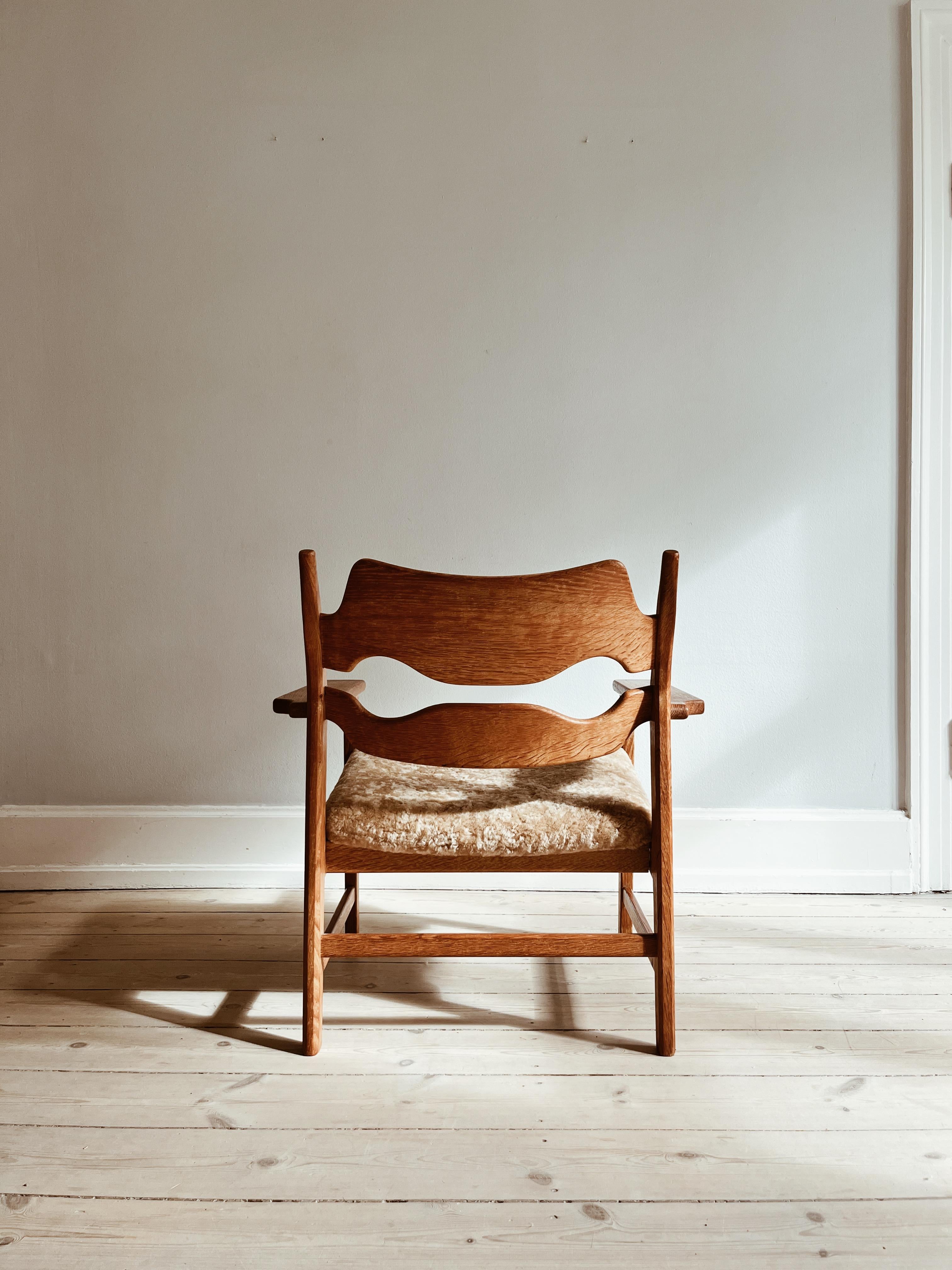 Mid-20th Century Henning Kjærnulf Razorblade lounge chair reupholstered in honey colored wool