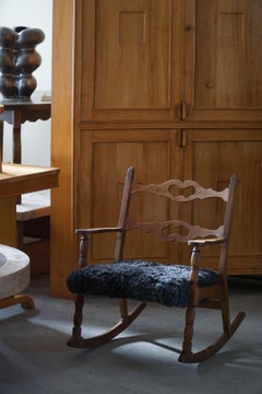 Henning Kjærnulf, Rocking Chair in Oak, Seat in Gotland Sheepskin, 1960s