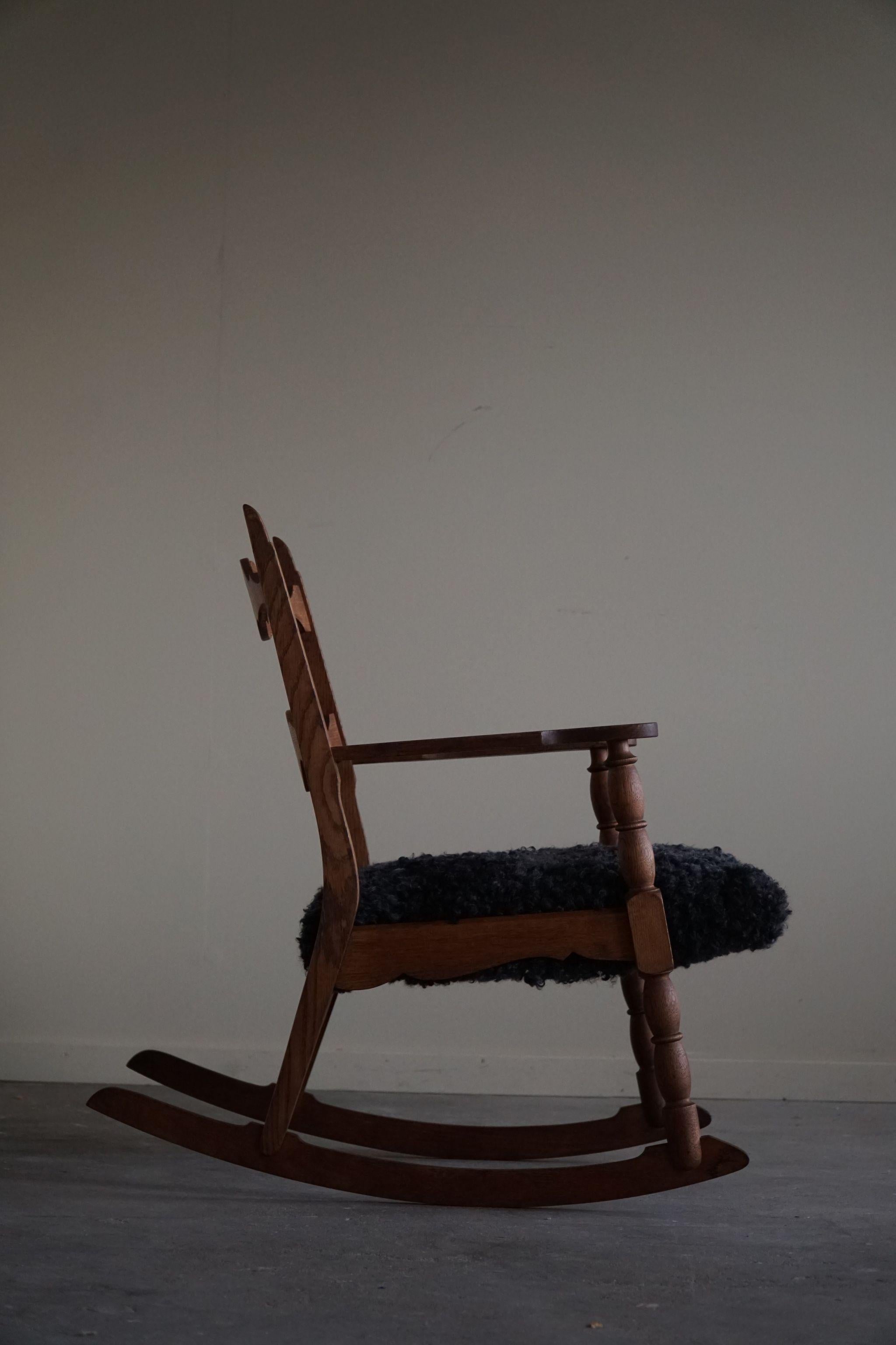 Henning Kjærnulf, Rocking Chair in Oak, Seat in Gotland Sheepskin, 1960s In Good Condition For Sale In Odense, DK
