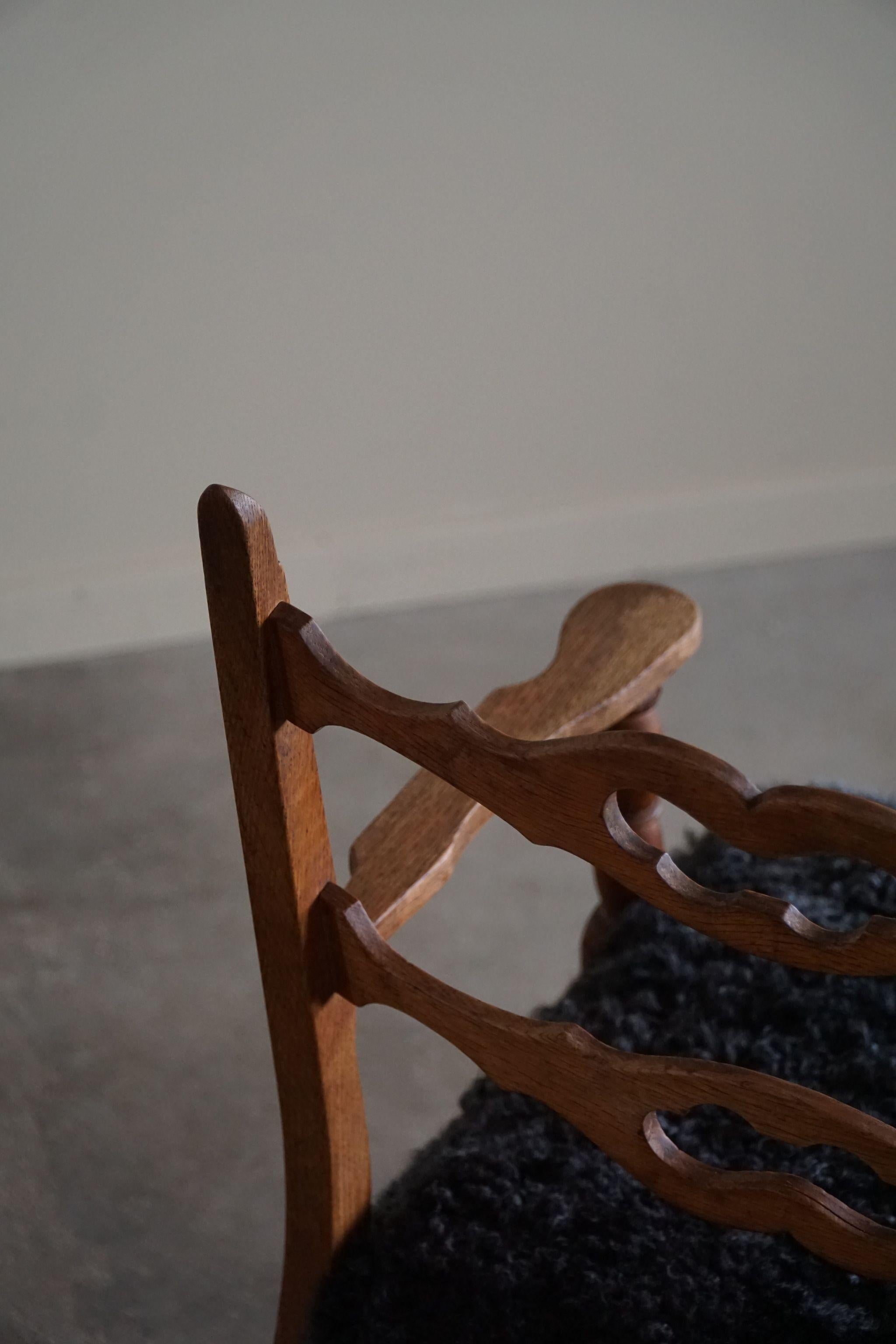 20th Century Henning Kjærnulf, Rocking Chair in Oak, Seat in Gotland Sheepskin, 1960s